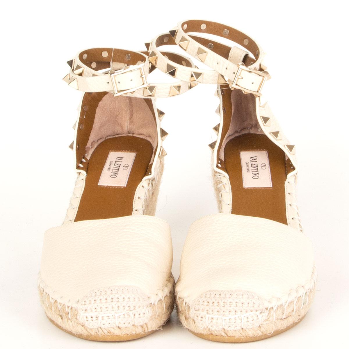 authentic Valentino Rockstud espadrille wedges in off-white textured-leather. Detailed with the brand's signature 'Rockstuds' along the double ankle strap. Have been worn once and are in virtually new condition. 

Imprinted Size 36
Shoe Size
