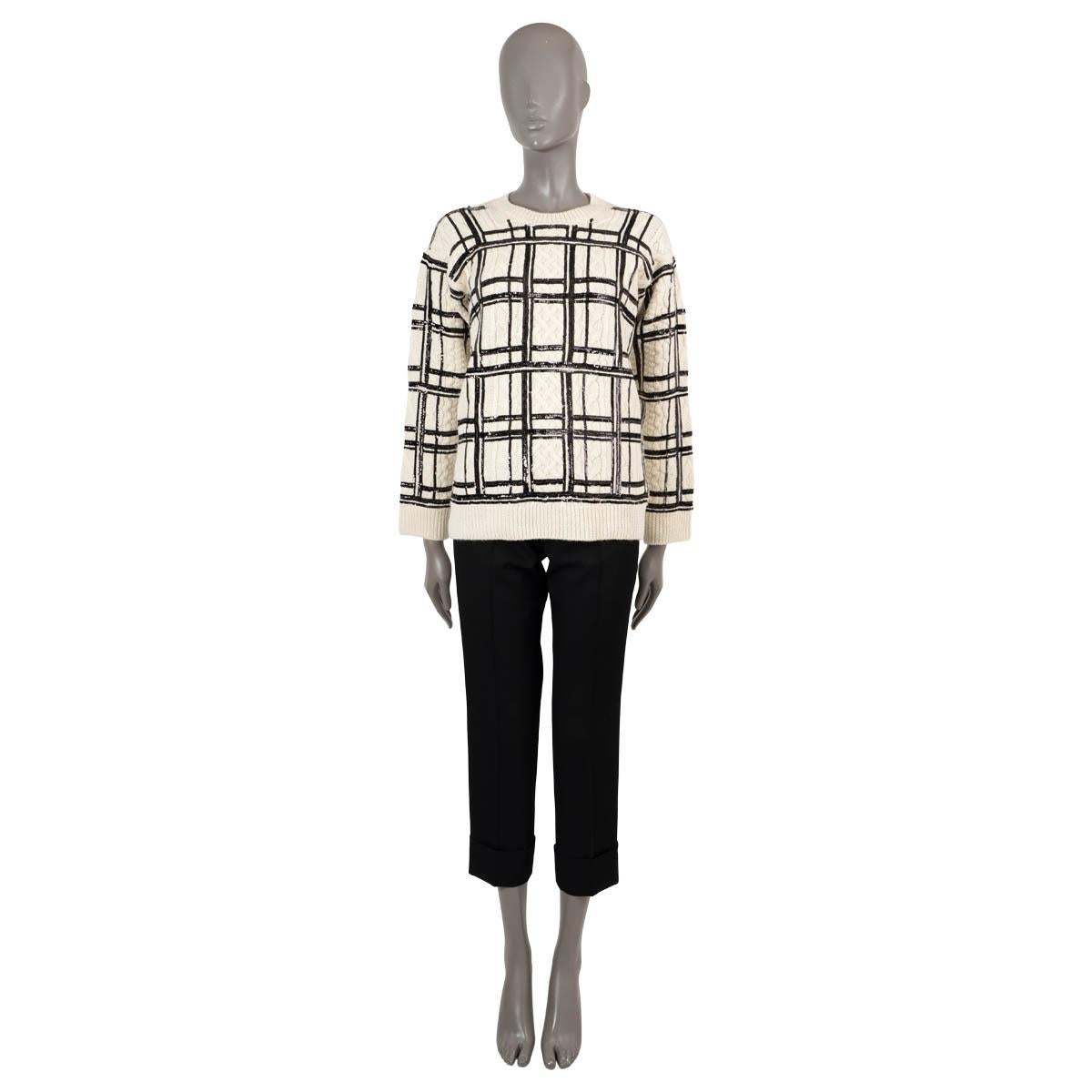 100% authentic Valentino cable knit sweater in cream wool (100%). Features plaid patterned sequins in black, a crewneck and rib knit cuffs and hem. Unlined. Has been carried and is in virtually new condition.

Measurements
Model	UB3KCB545S6
Tag