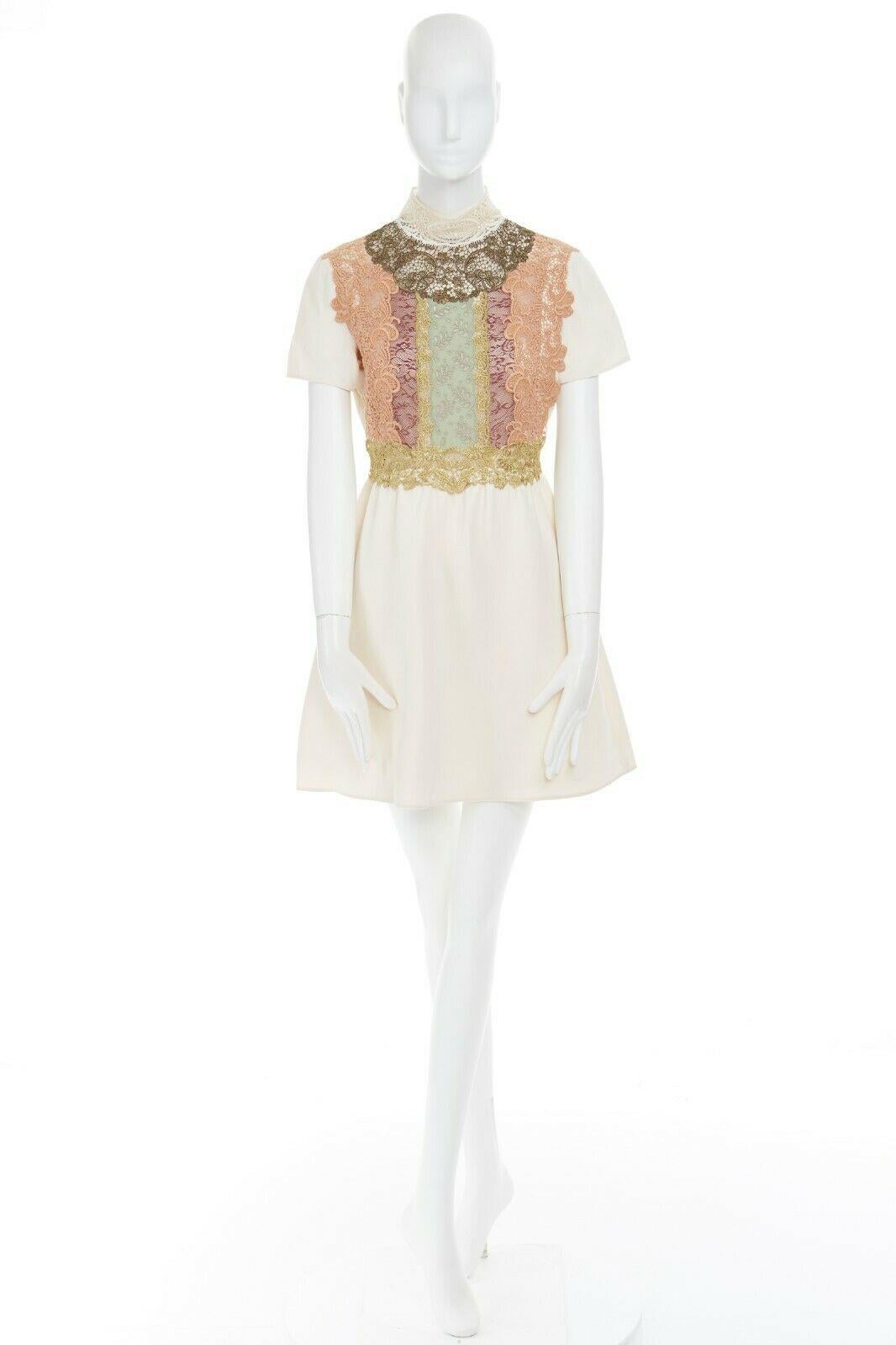 VALENTINO cream wool silk crepe embroidered lace high collar cocktail dress IT42 Reference: LACG/A00271 
Brand: Valentino 
Material: Virgin Wool 
Color: Cream 
Pattern: Other 
Closure: Zip 
Extra Detail: Virgin wool, silk. Cream crepe. High lace