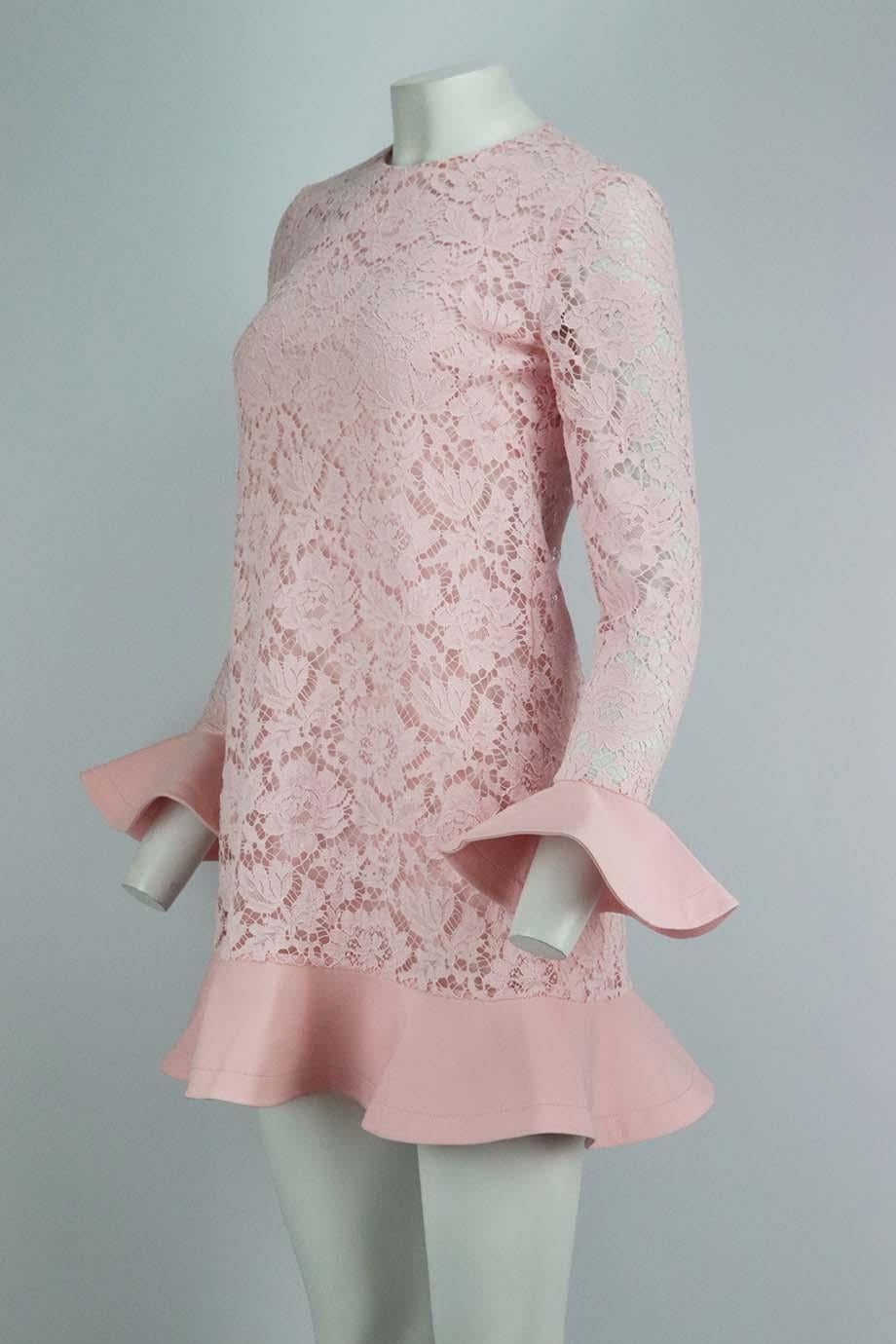 This mini dress by Valentino is cut from pink guipure lace layered over a stretchy silk-georgette lining for coverage, this elegant style has a dropped waist and romantic crepe-trimmed ruffles at the cuffs and hem. Pink cotton-blend guipure lace,
