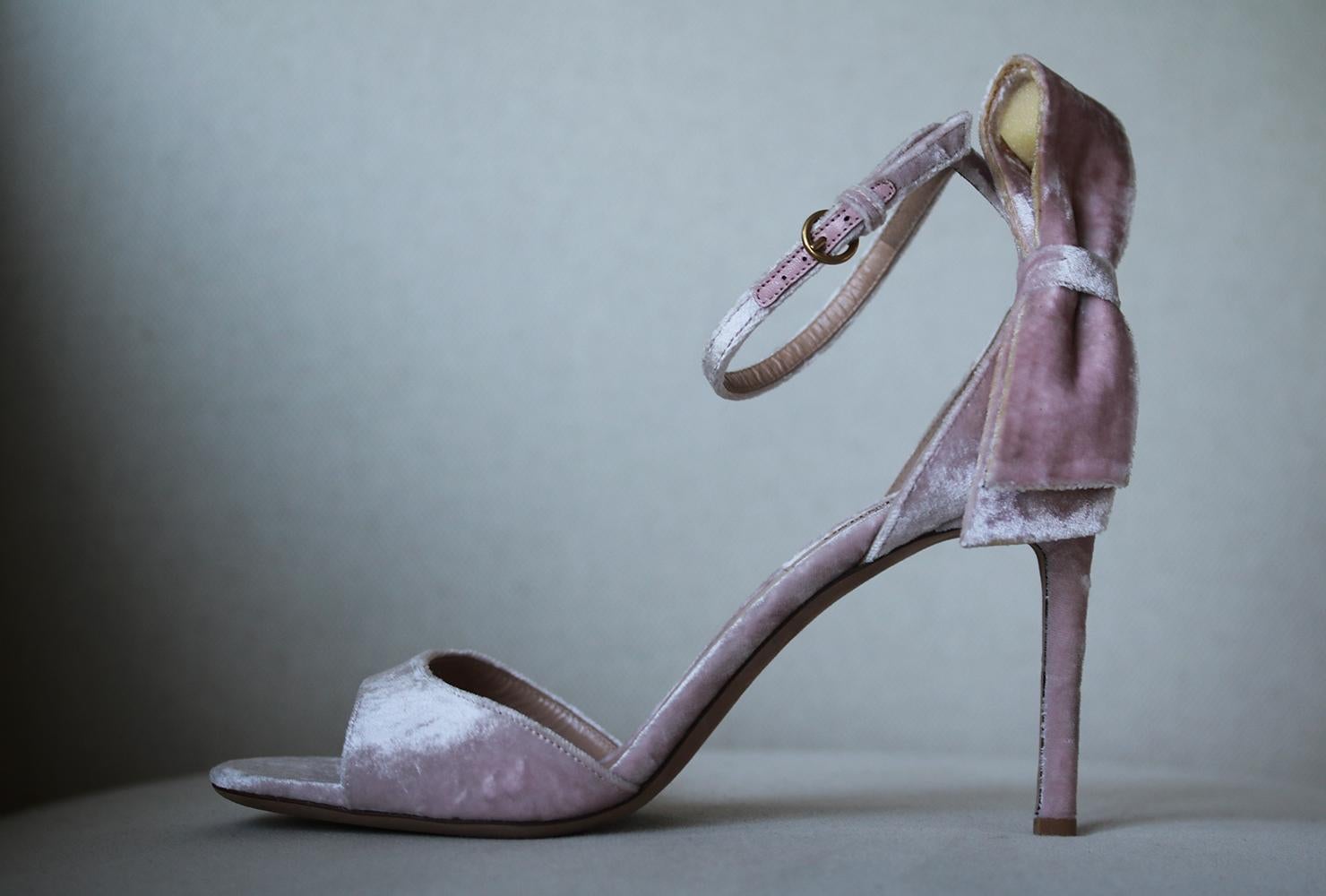 Valentino's sandals have been made in Italy from crushed-velvet - a fabric that's set to have a another major moment come fall. They're detailed with a bow at the heel and have delicate ankle straps. Heel measures approximately 85mm/ 3.5 inches.