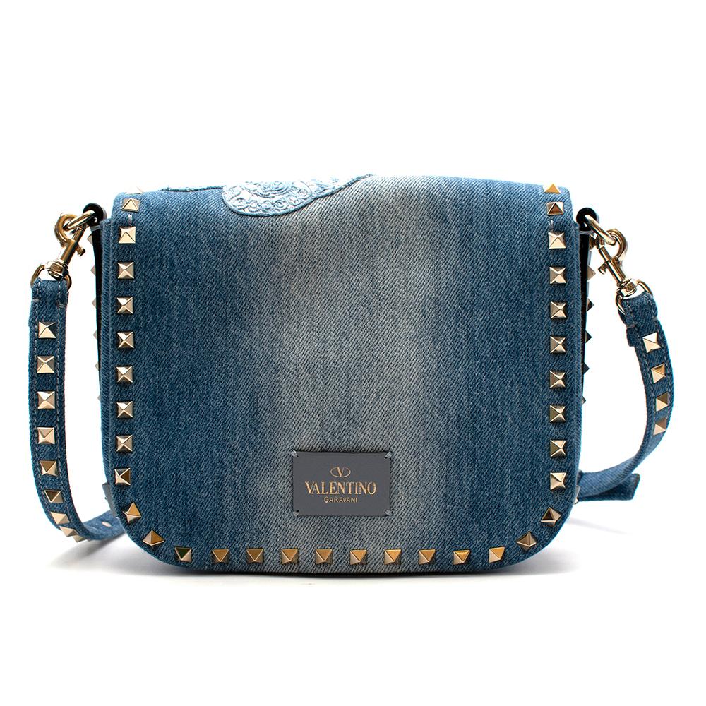 Valentino Butterfly Embroidered Rock Stud Denim Bag

- Embroidered butterflies stitched onto the denim
- Gold rock studs around the bag
- Gold shiny clasp to secure the bag
- Mid wash denim
- Denim lining 
- Inside zipped pocket
- Detachable denim