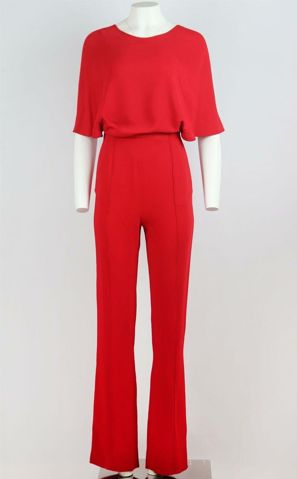 Valentino's jumpsuit has been expertly crafted in Italy from silk-crepe in a bold and brilliant red hue, designed with a draped front, it has tailored pants and turns to reveal a crossover back.
Red silk-crepe.
Concealed zip fastening at back.
100%