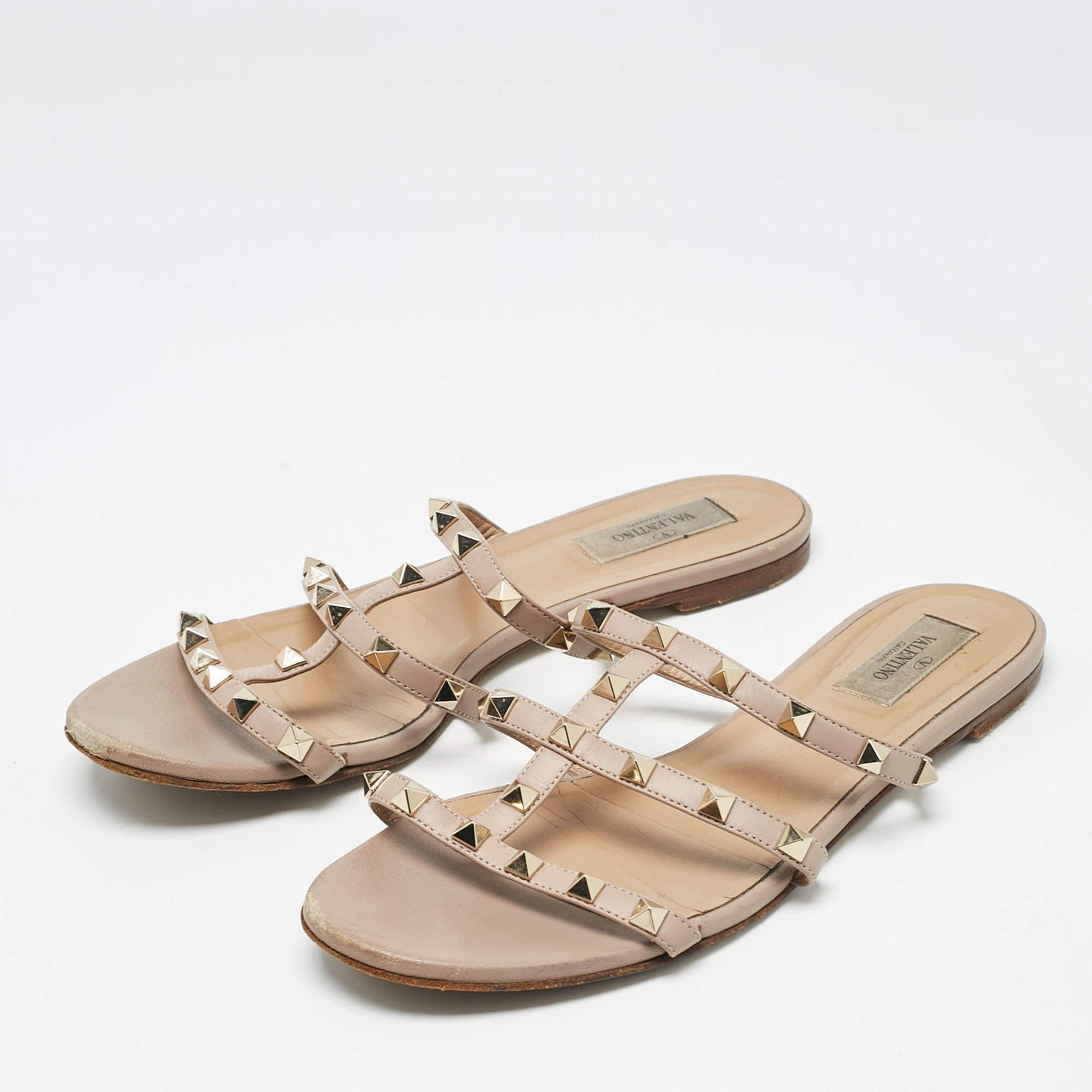 Enhance your casual looks with a touch of high style with these designer slides. Rendered in quality material with a lovely hue adorning its expanse  this pair is a must have