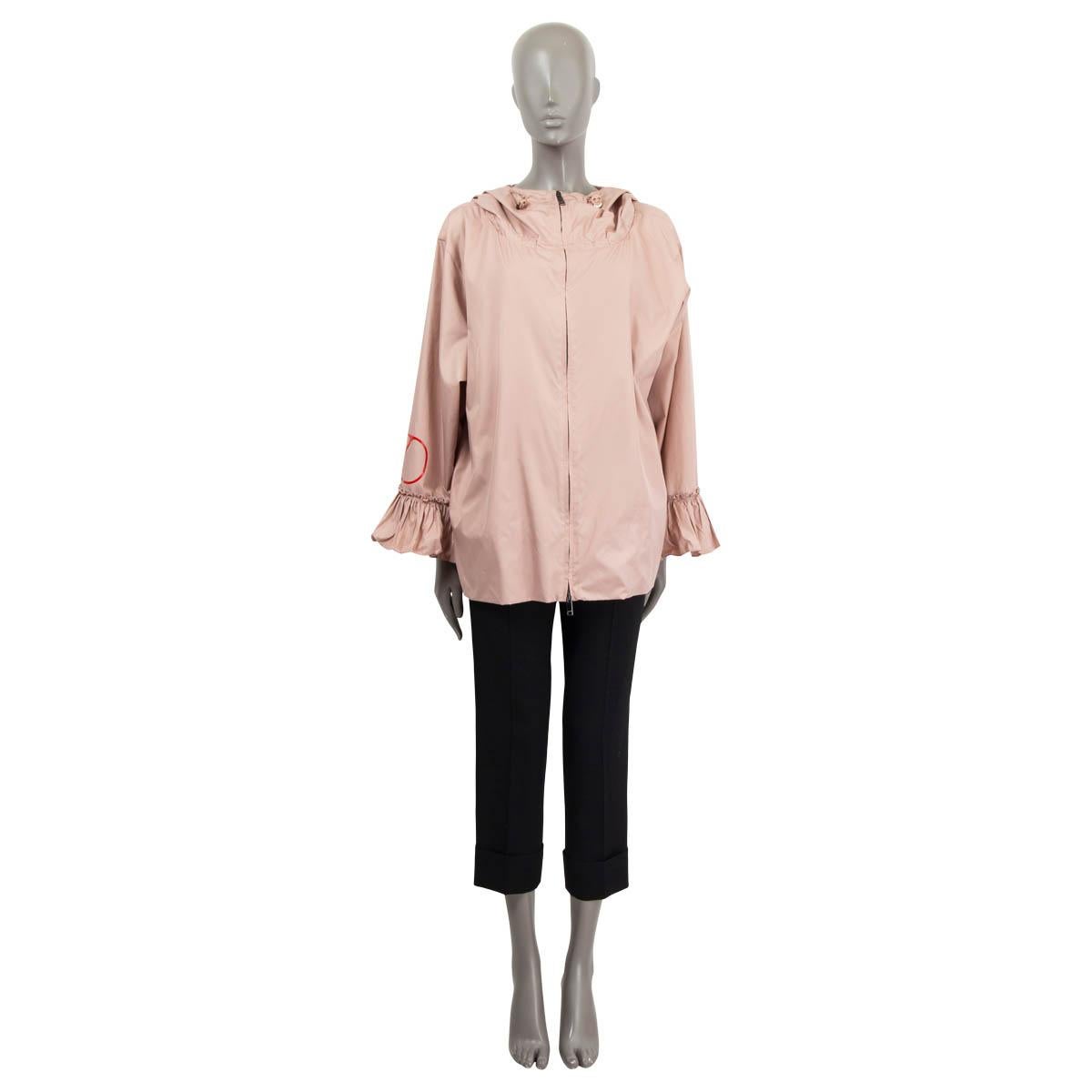 100% authentic Valentino hooded rain jacket in dusty rose polyester (100%). Features the V logo at one sleeve, two side slit pockets and gathered cuffs. Has a drawstring closure at the neck and the hips. Opens with a zipper on the front. Unllined.