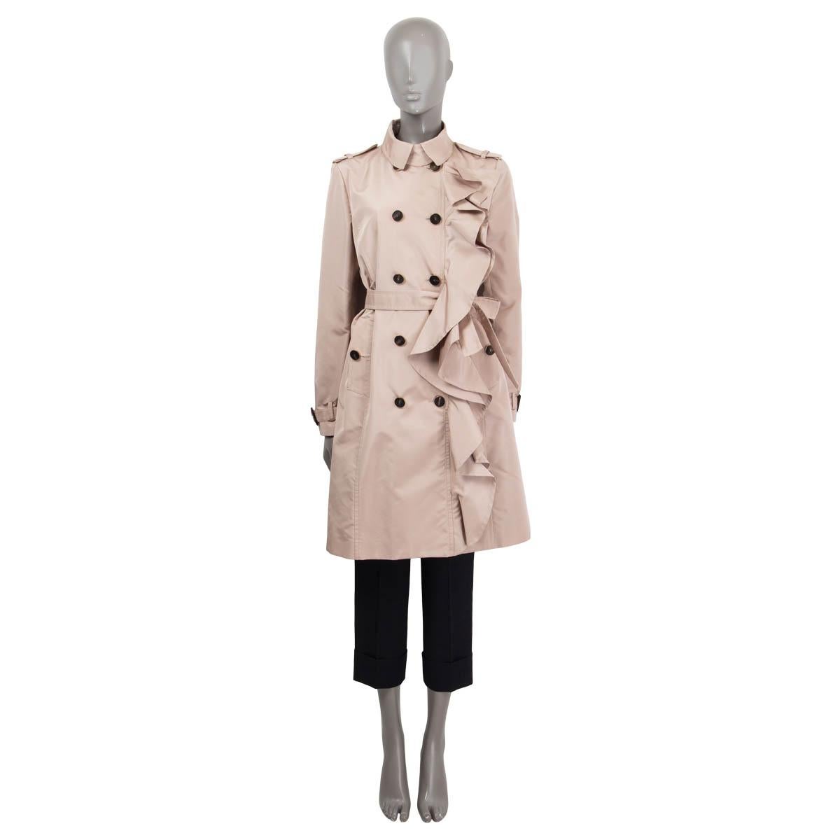 100% authentic Valentino ruffled double breasted trench coat in dusty rose silk (52%) and polyester (48%). Features epaulettes at the shoulders and the cuffs. Has two buttoned slit pockets, a detachable belt and belt loops. Opens with a hook at the