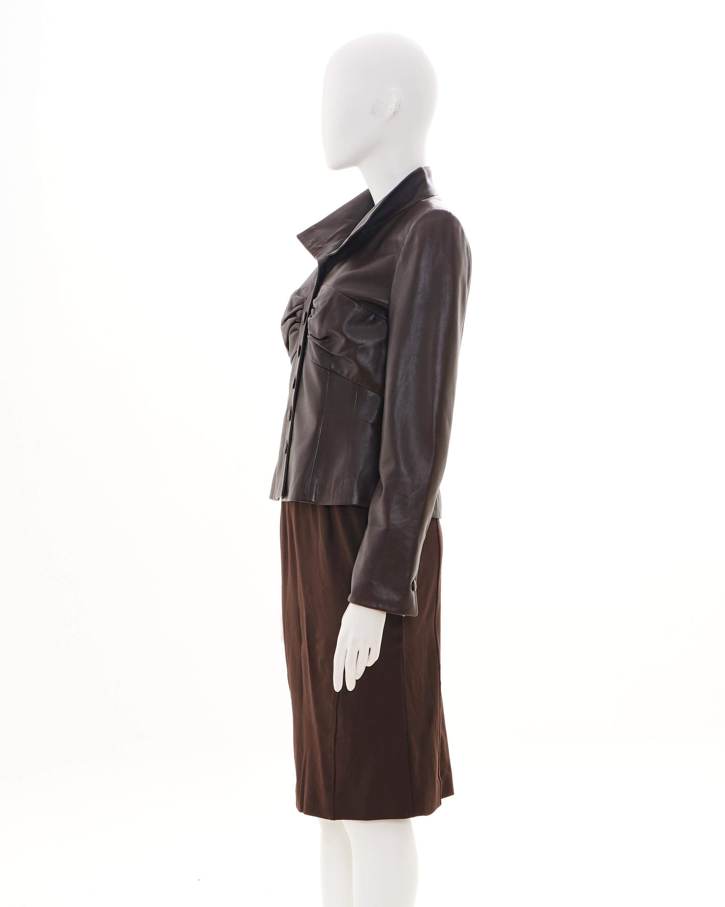 - Designed by Valentino
- Sold by Skof.Archive
- Early 00's
- Leather Jacket 
- Boucled Details
- Button Up Closure
- Tube Brown Skirt
- Midi Length
- Made in Italy
- Materials: Jacket - Leather / Skirt - Wool and Silk
- Excellent Condition
- Size: