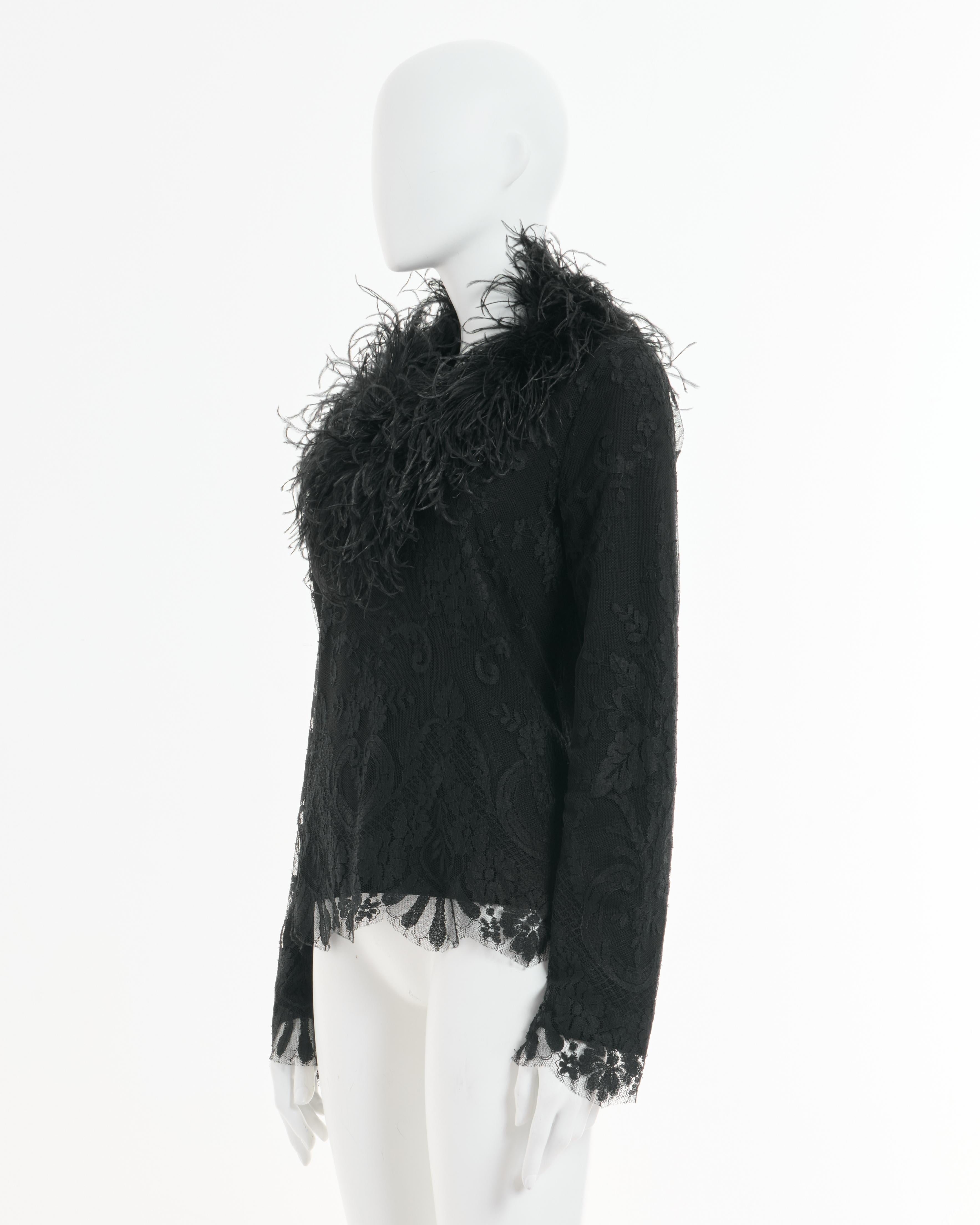- Designed by Valentino Garavani
- Sold by Skof.Archive
- Black floral lace feathers sweater 
- Feather-trimmed neckline
- Sheer lace construction with intricate baroque-inspired motifs
- Natural feather embellishments 
- Sculptural effect around