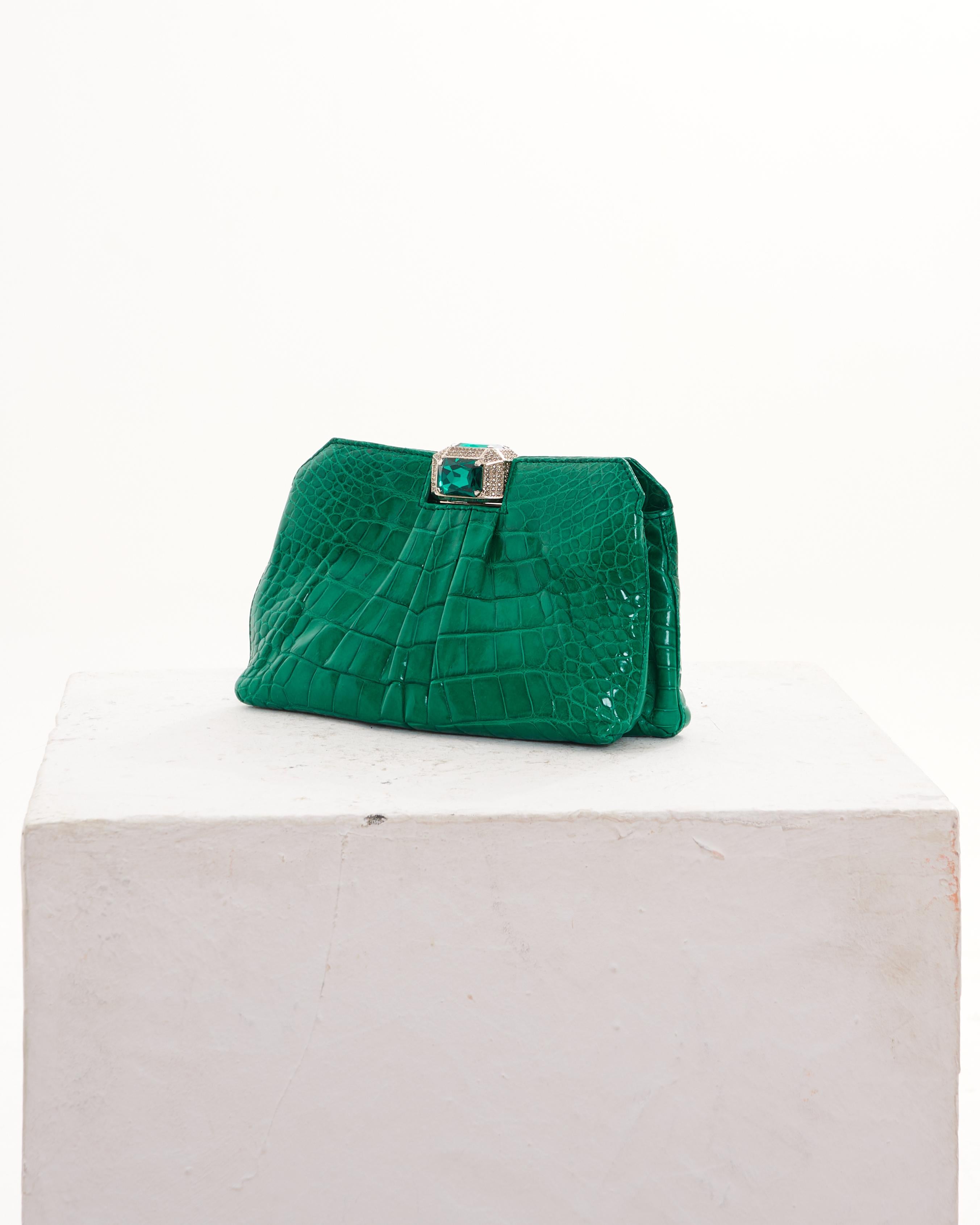 - Designed by Valentino Garavani
- Early 00's
- Sold by Skof.Archive
- Green Embellished Pochette Bag
- Emerald Closure
- Crocodile Leather 
- Excellent Codition
- Made in Italy