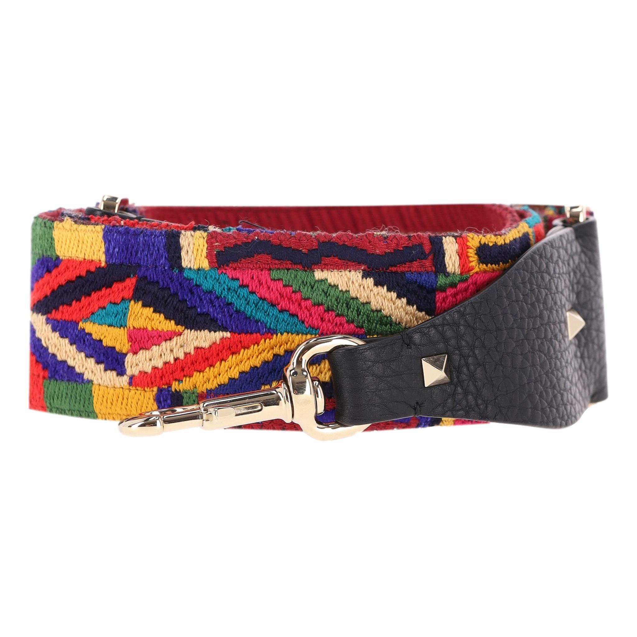 Valentino Embroidered Bag Strap 

Brightly coloured bag strap embroidered with geometric pattern and finished with black leather ends that have the iconic rock studs in silver and lobster closure.

Rrp Approx. £1000

Size - One Size

Condition