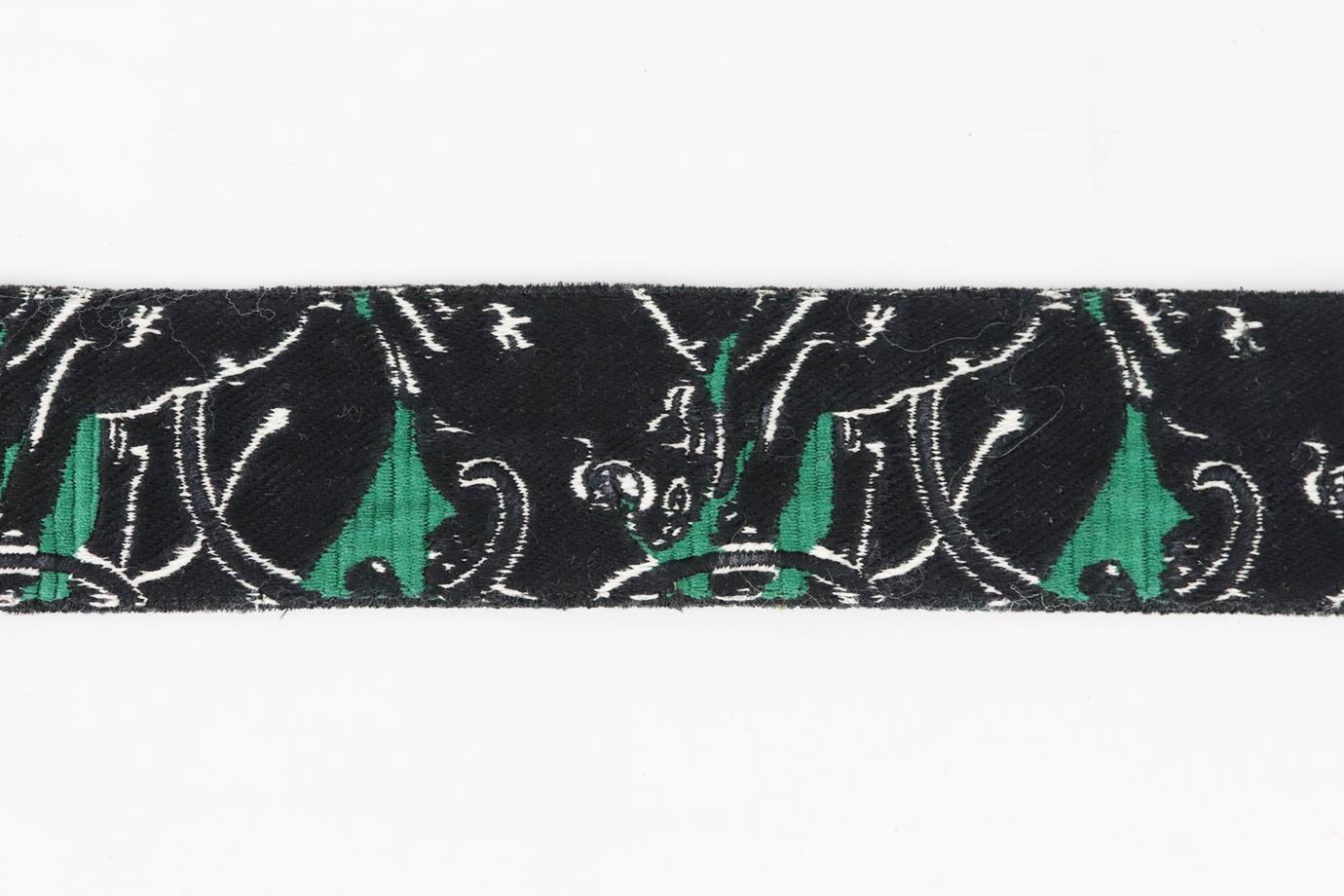 Valentino embroidered canvas and leather bag strap. Made from black and green panther embroidered canvas and black leather and silver-tone clasps. L: 41 in. W: 2 in