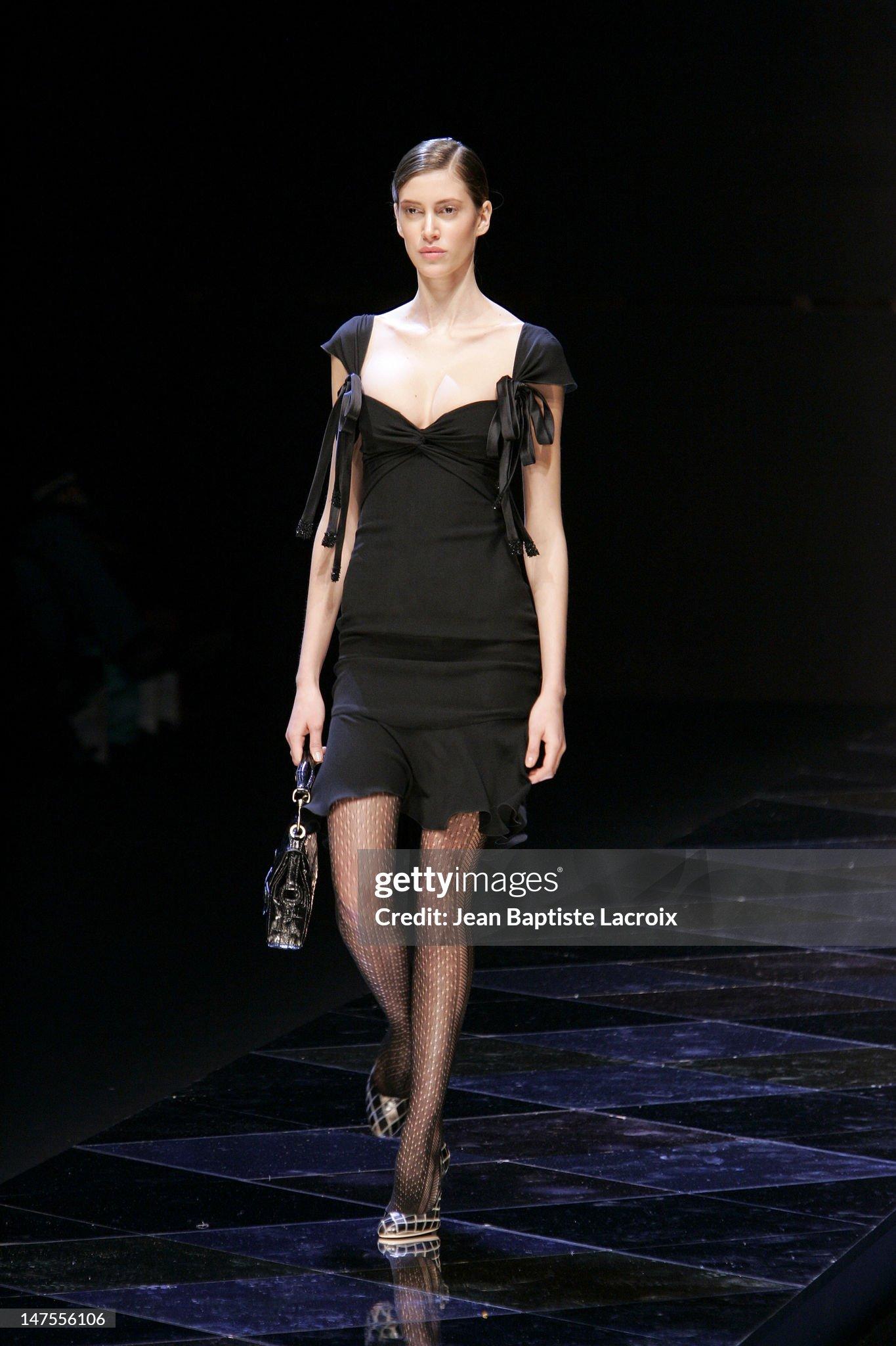 - Designed by Valentino Garavani
- Sold by Skof.Archive
- Fall-Winter 2005 
- Little black cocktail dress 
- Embellished bow on the straps 
- Runway look 56
- Back hidden zipper closure 
- Made in Italy 
- Materials: 100% Silk 
- Size: FR 38 - EN 42