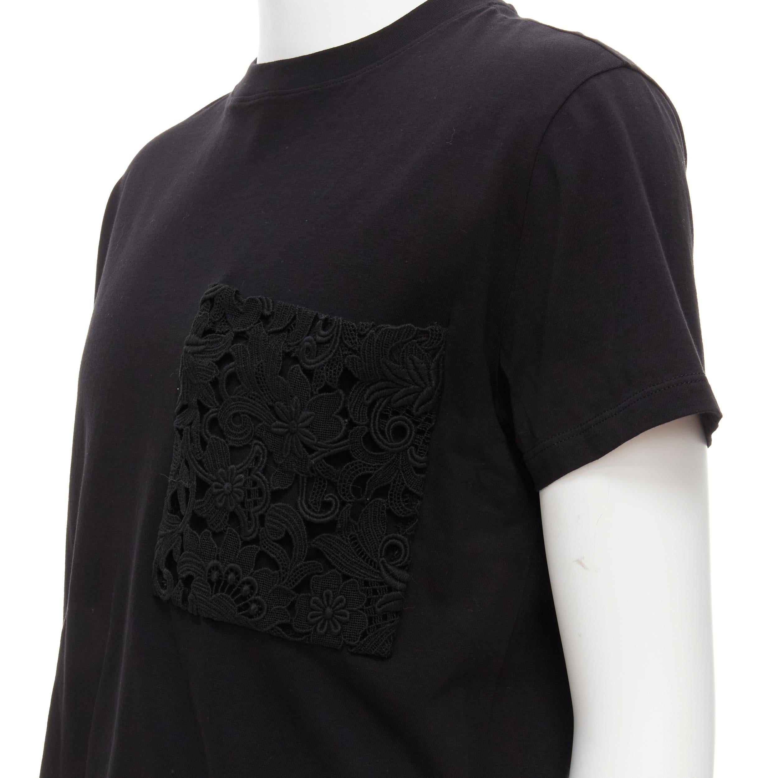 VALENTINO floral lace breast pocket white logo black cotton tshirt S 
Reference: CRTI/A00725 
Brand: Valentino 
Material: Cotton 
Color: Black 
Pattern: Lace 
Extra Detail: Lace patch breast pocket. 
Made in: Italy 

CONDITION: 
Condition:
