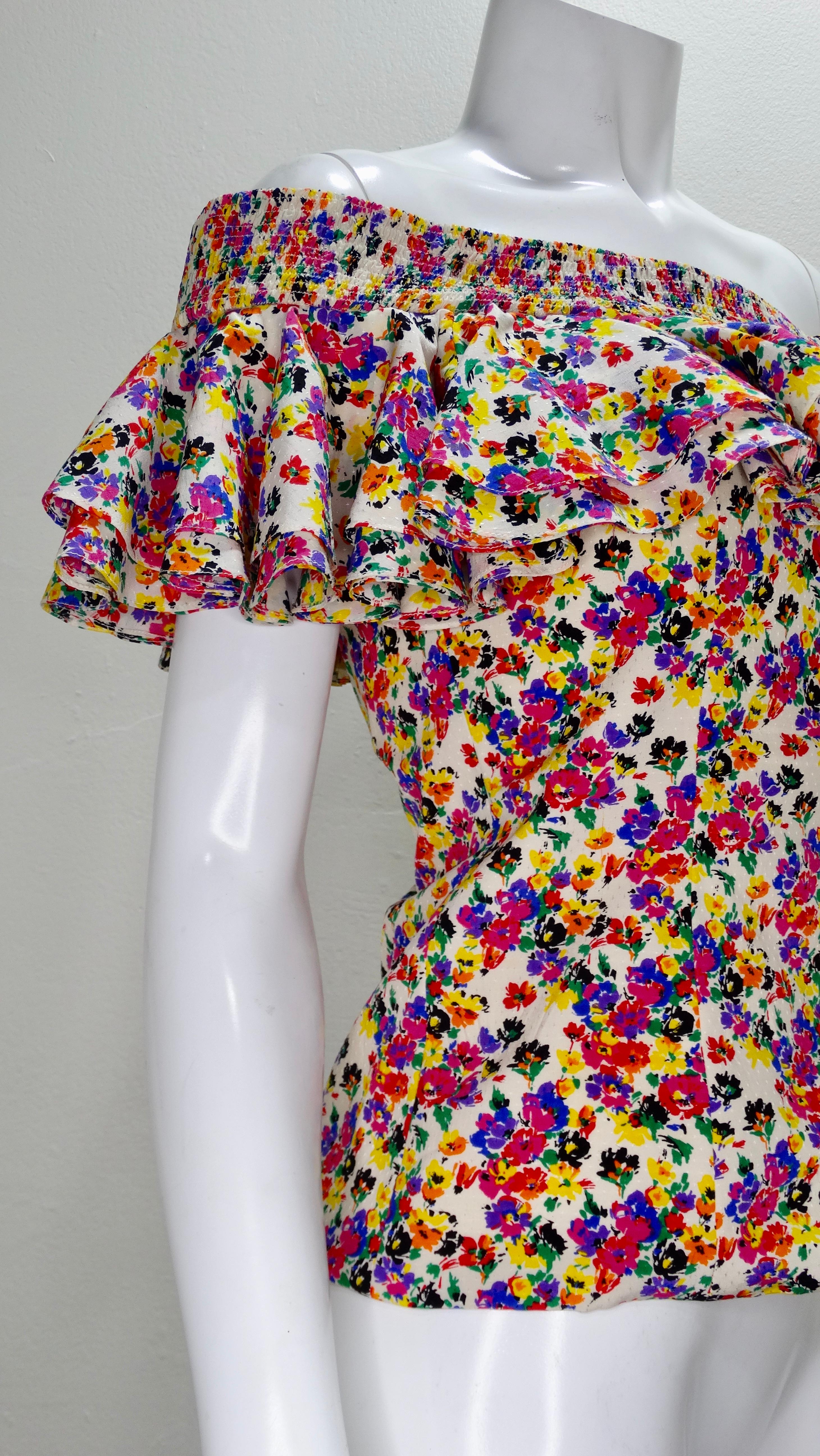 This vintage floral 1980s Valentino for Capriccio blouse is a perfect statement piece for any occasion! Made in Italy and 100% silk, this colorful blouse features ruching around the collar for a perfect fit as well as ruffles for an ultra feminine