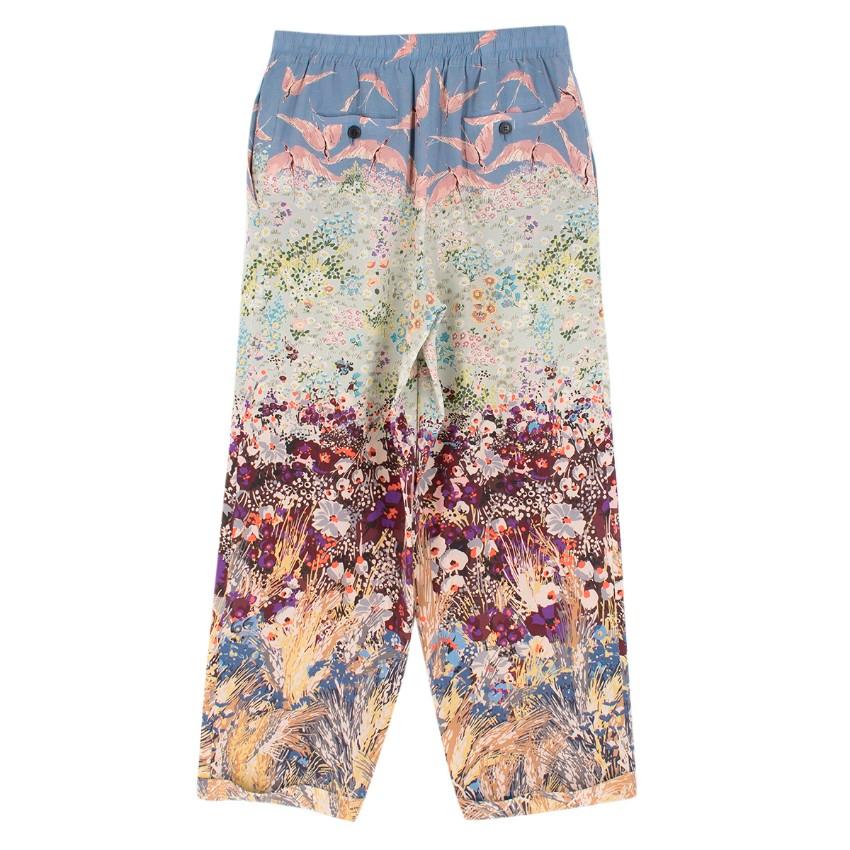 Valentino Floral Print Silk Trousers

-Floral and bird print trousers
-Silk trousers
-Elasticated waistline
-Tie up waistline
-Turned up cuffs
-Two front pockets
-Two back pockets

Approx.
Measurements are taken laying flat, seam to seam. 

Length -