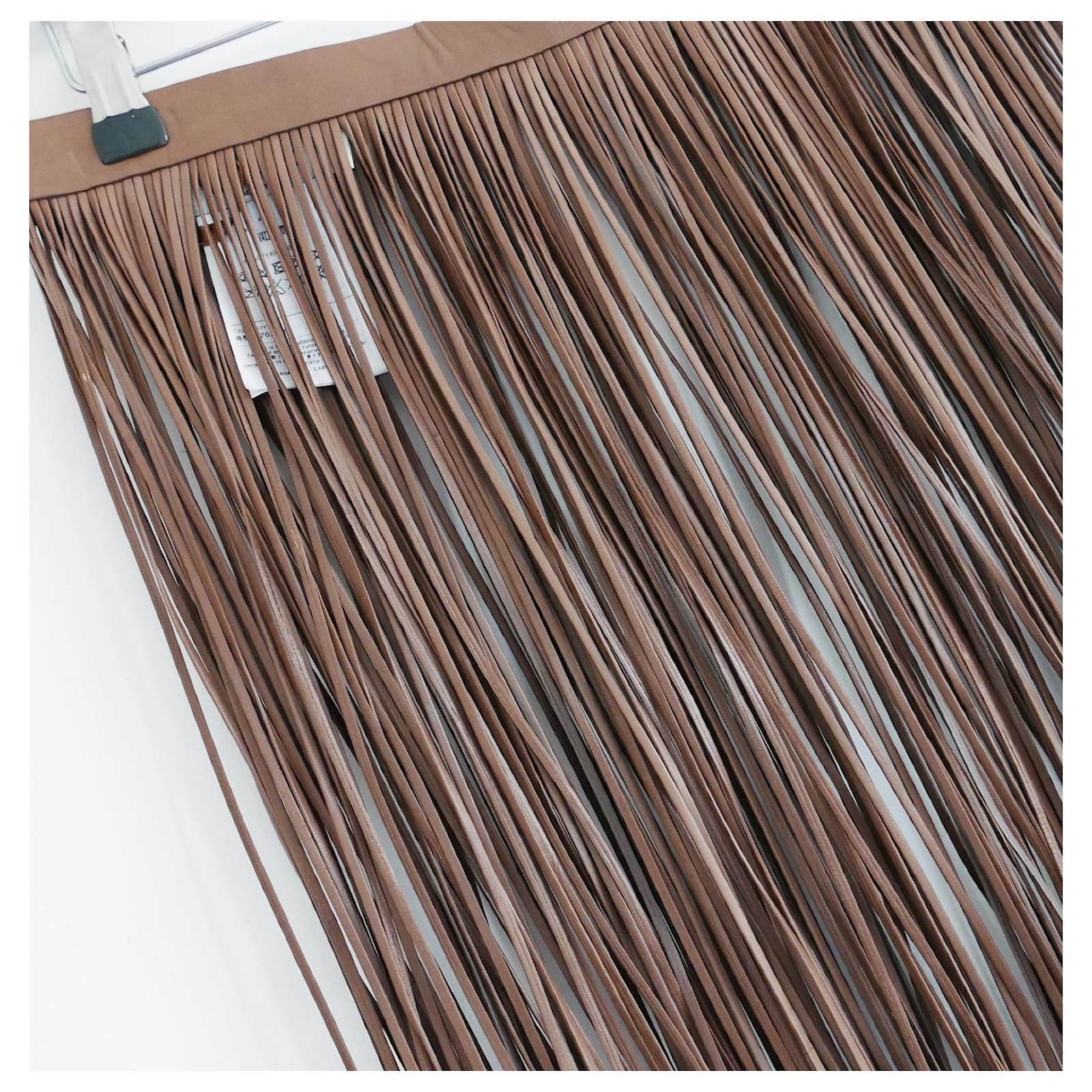 The most amazing Valentino fringed leather over skirt - bought for £3045 and new with tags. Made from taupe leather with long, free moving fringe and flat waistband with hooks to fasten at back. Size IT42/UK10. Measures approx - waist 28