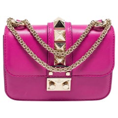 Valentino - Mini sac à bandoulière en cuir fuchsia avec fermeture à glissière Rockstud