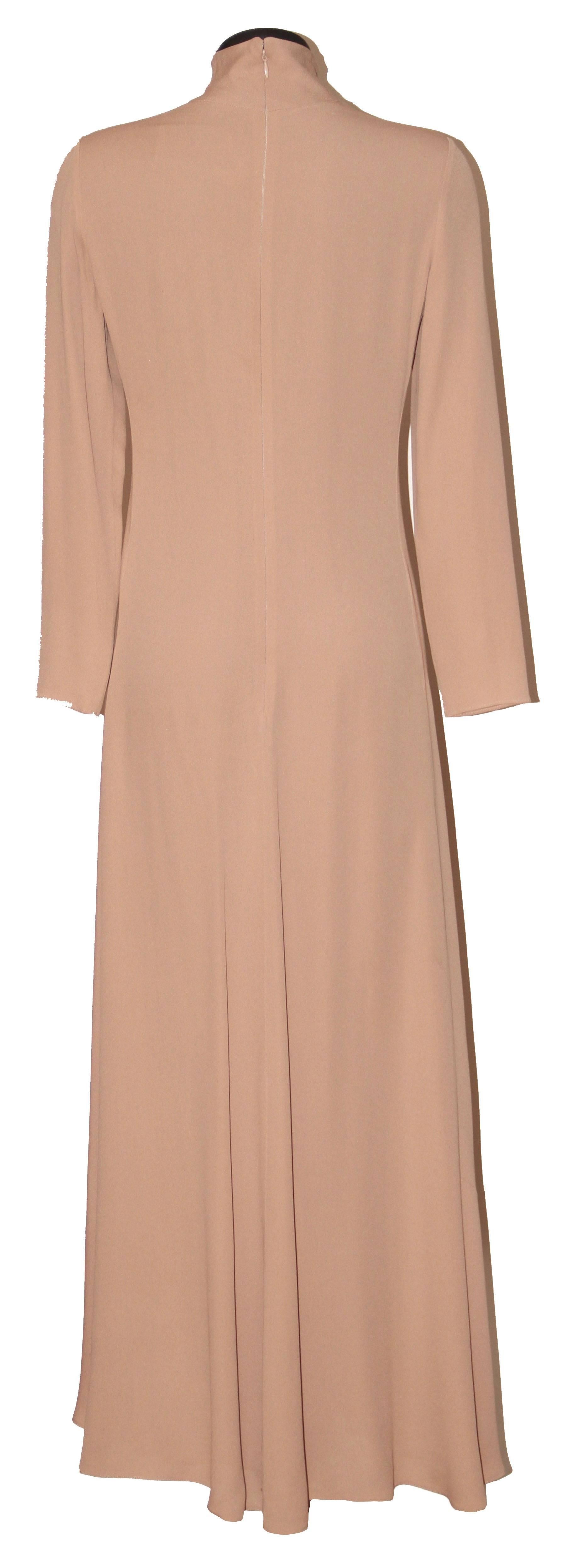 Stunning long dress by Valentino with an understated shape for an amazing silhouette (less is more). 
The dress features long sleeves, a turtle collar, a back zip and a flared skirt. 

Collection: Fall-Winter 2016/2017
Fabric: Tag removed - Made of