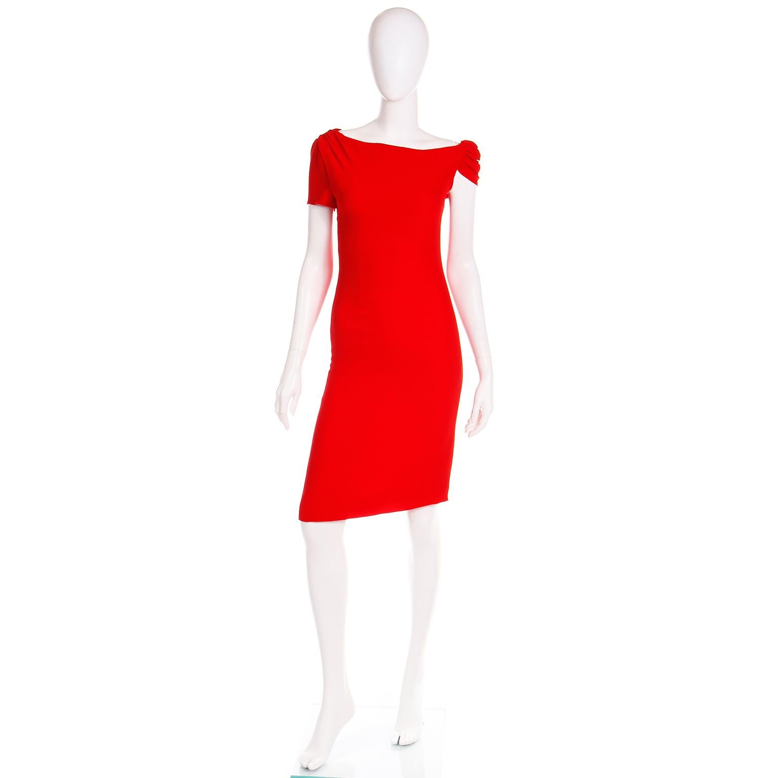 We always love vintage Valentino Garavani pieces and this beautiful day or evening sheath dress is in the iconic Valentino red. This is a very flattering shade of red and it is Valentino's signature hue.

This red silk crepe sheath dress is fully