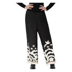 Pantalones de pata ancha con estampado abstracto Valentino Garavani Talla S