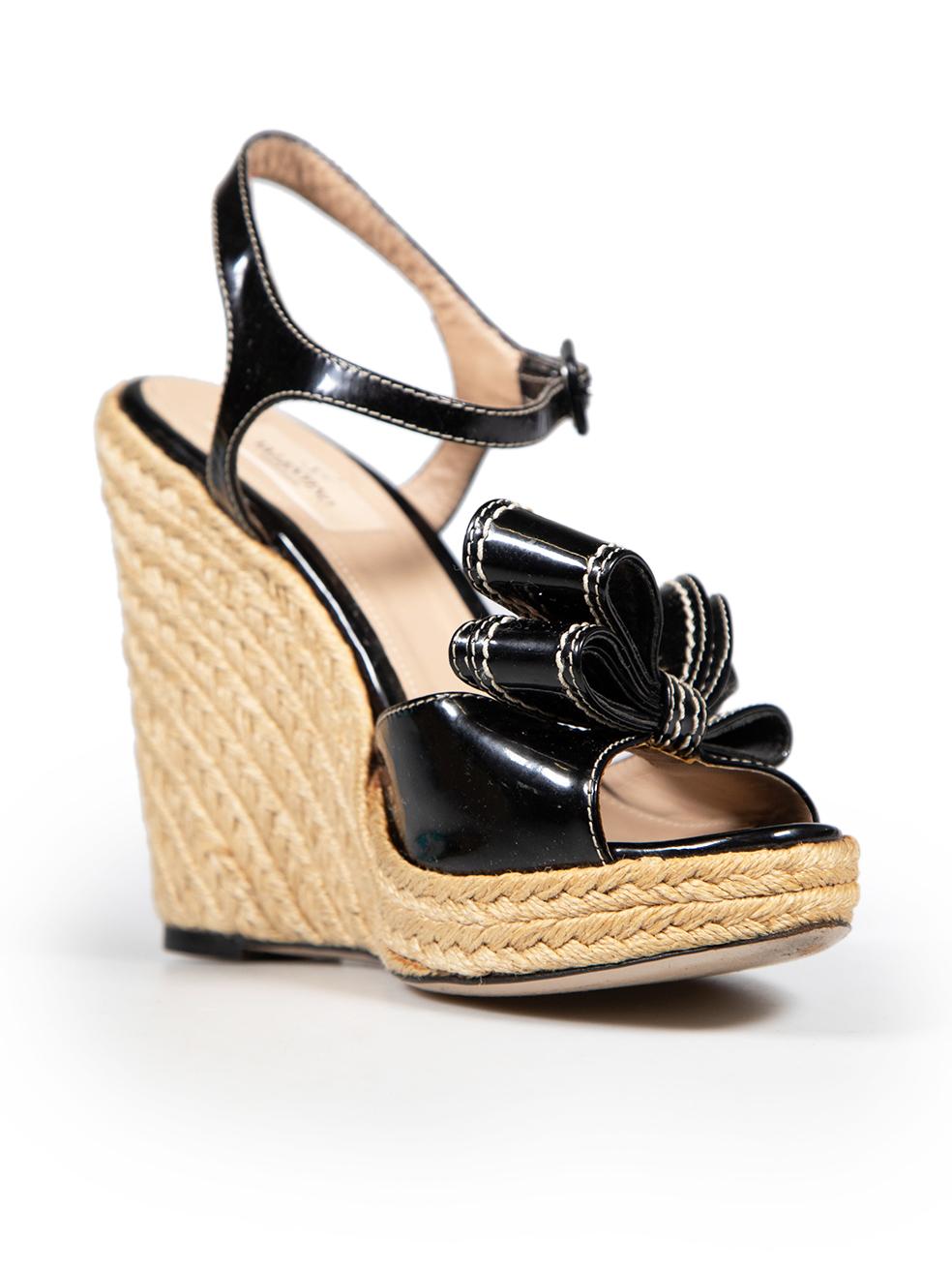 CONDITION is Very good. Minimal wear to the sandals is evident. The woven part of both heels has mild discolouration on this used Valentino Garavani designer resale item.
 Details
 Black
 Patent leather
 Sandals
 Open toe
 Front bow detail
 Ankle