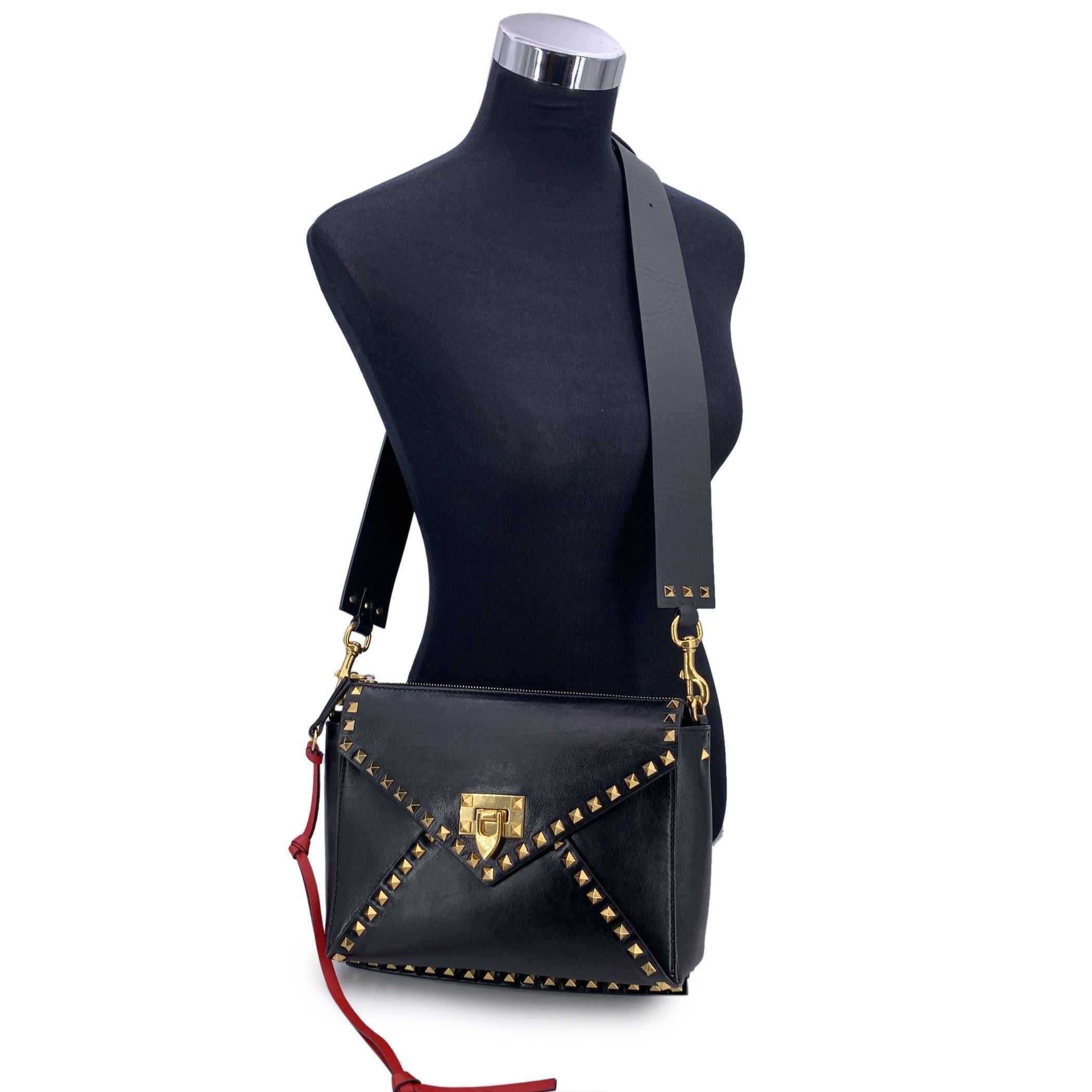 Step into timeless Italian elegance with the Valentino Garavani Rockstud Hype Leather Crossbody Bag-a standout piece from the legendary Rockstud collection that helped define a decade of bold, urban luxury. Crafted in supple leather and finished