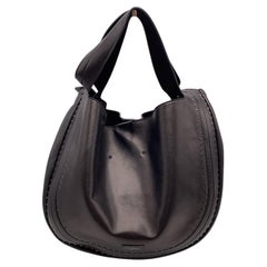 Valentino Garavani - Sac fourre-tout en cuir noir clouté de style Slouchy