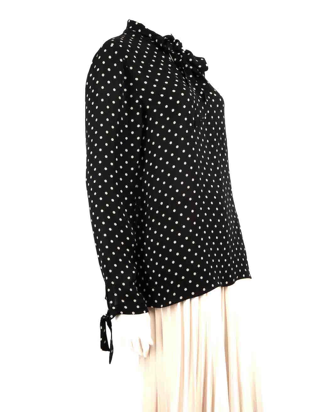 CONDITION is Very good. Minimal wear to blouse is evident. There is an area to the front of the blouse with plucks to the weave on this used Valentino designer resale item.
 
 Details
 Black
 Silk
 Blouse
 Polkadot pattern
 Long sleeves
 Sheer
 Neck
