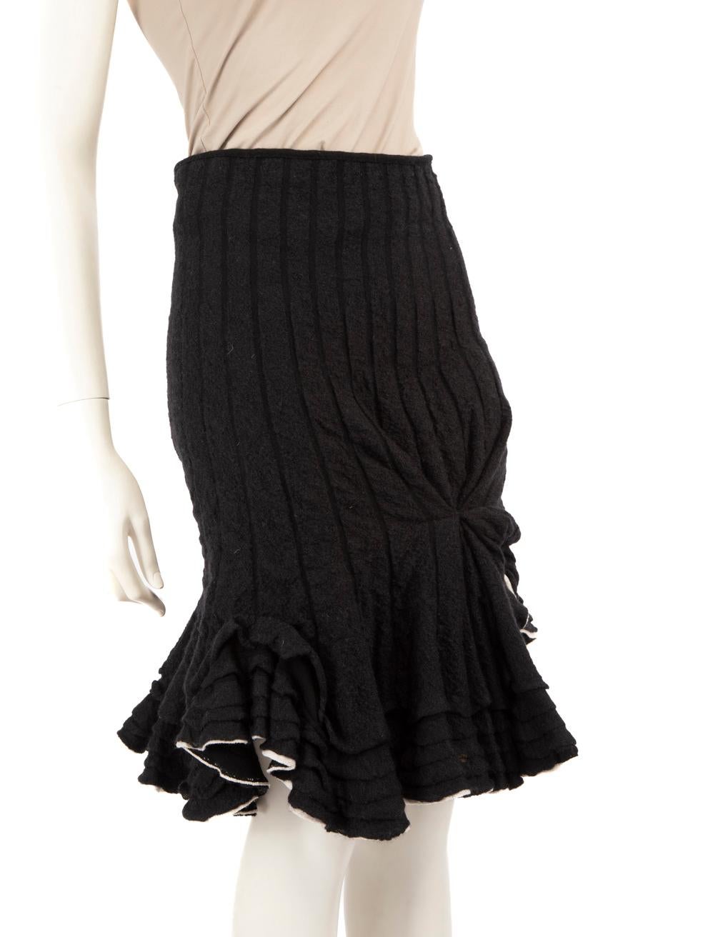 CONDITION is Very good. Hardly any visible wear to skirt is evident on this used Valentino Garavani designer resale item.
 Details
 Black
 Wool
 Flared skirt
 Stretchy
 Figure hugging
 Ruffled hemline
 Knee length
 
 
 Made in Italy
 
 Composition
