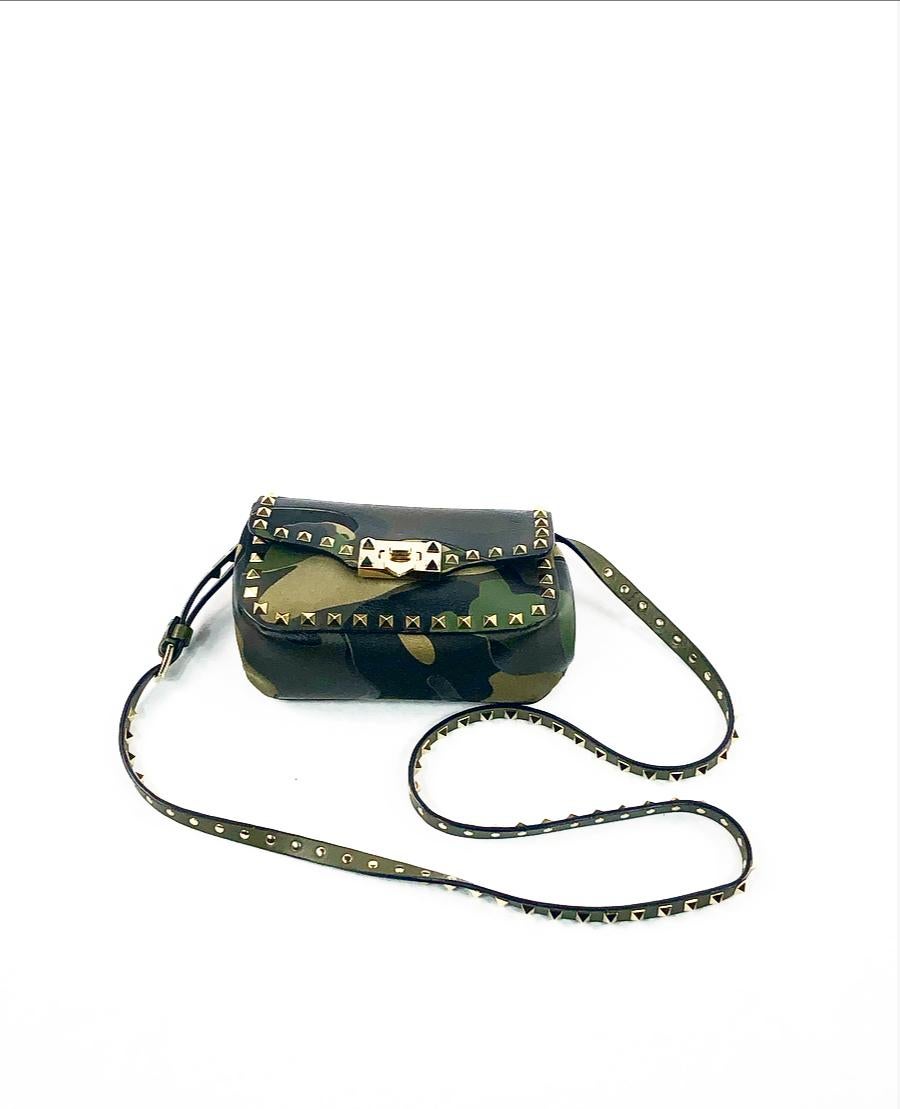 VALENTINO Camouflage Rockstud Mini Crossbody Bag in Green

Product details:
The bag comes with the original dust bag
Green and red leather and canvas with camouflage print
Gold- tone hardware 
Detachable and adjustable shoulder strap
Front flap with
