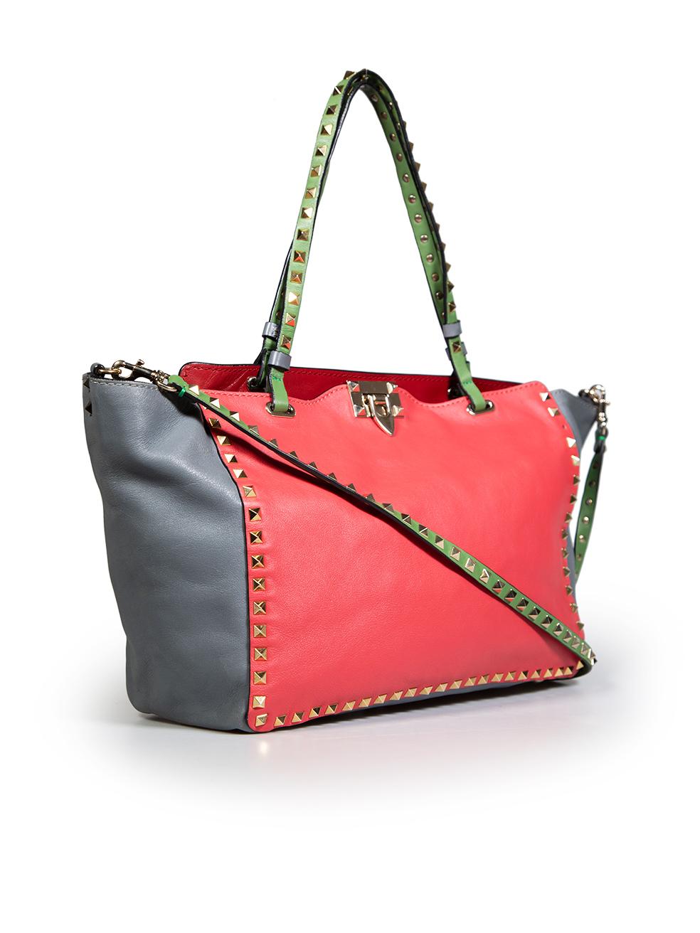 CONDITION is Very good. Minimal wear to the bag is evident. There are abrasions to the bag's front, back, bottom, and hardware clasp. One spike from the front and one spike from the back of the bag are missing on this used Valentino Garavani