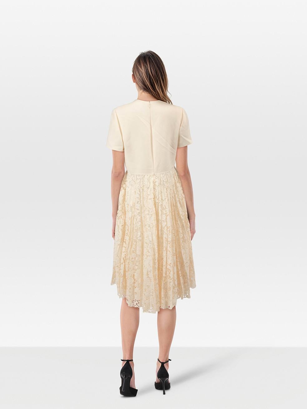 CONDITION is Never worn, with tags. Due to poor storage of the dress, the composition label is hanging loose on one side. One mark on the front right towards the bust on this new Valentino Garavani designer resale item. Mark may need gentle hand
