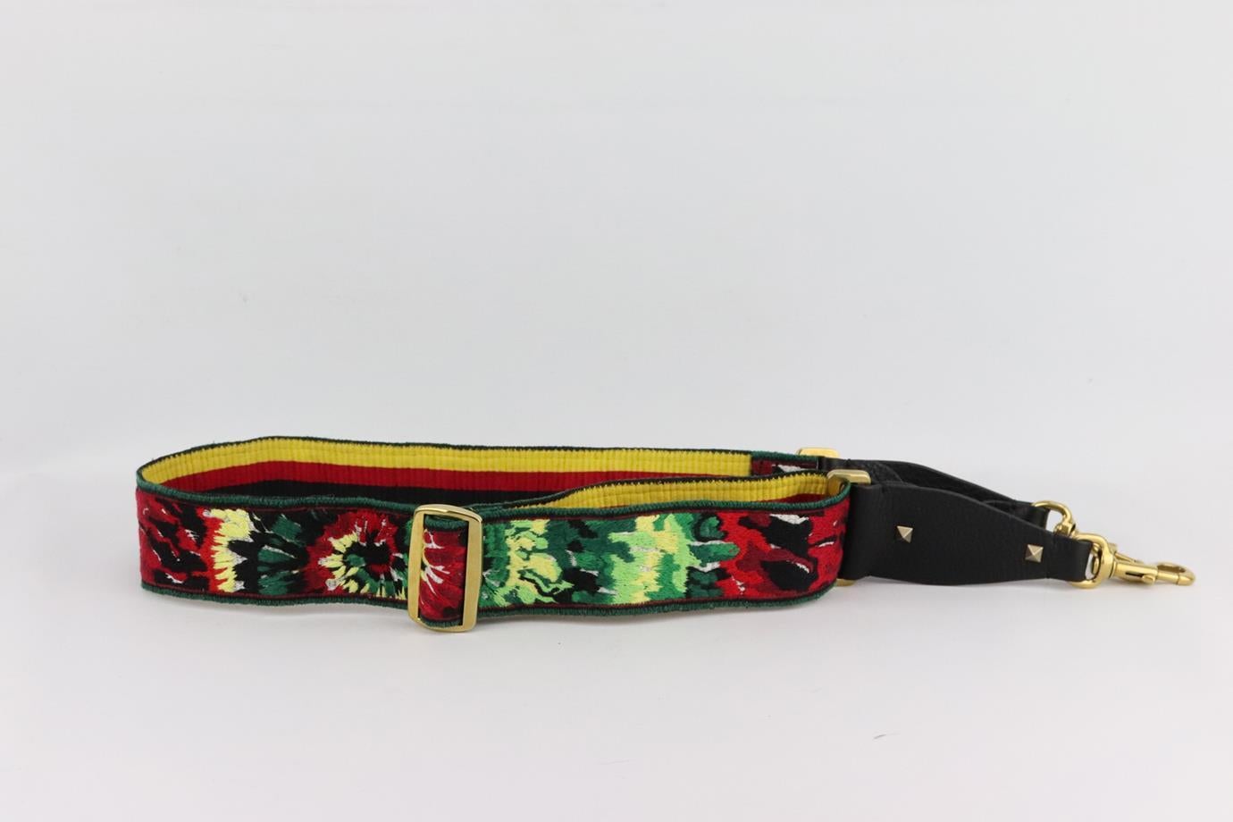 Valentino Garavani customised embroidered canvas and leather bag strap. Red, green, black, white and yellow. Lobster clasp fastening at base. Does not come with box or dustbag. Max. Length: 51 in. Min. Length: 34 in. Width: 2 in. Very good condition