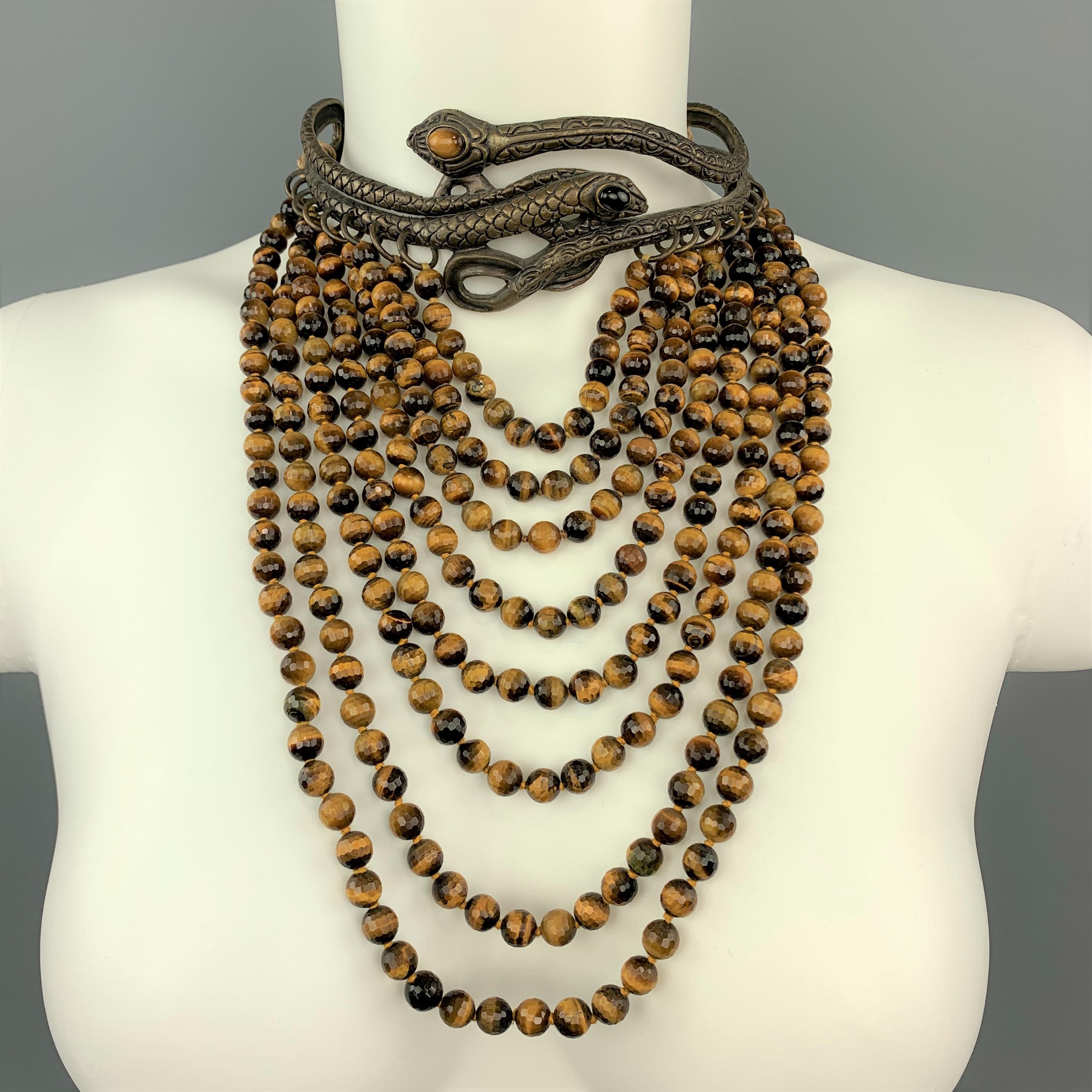 VALENTINO GARVANI Fall Winter 2002 Couture Collection runway necklace features antique dark gold tone metal snakes motif choker with black and amber stone eyes, cascading tiger's eye beaded drop strands, and tassel tie back closures. 

Excellent