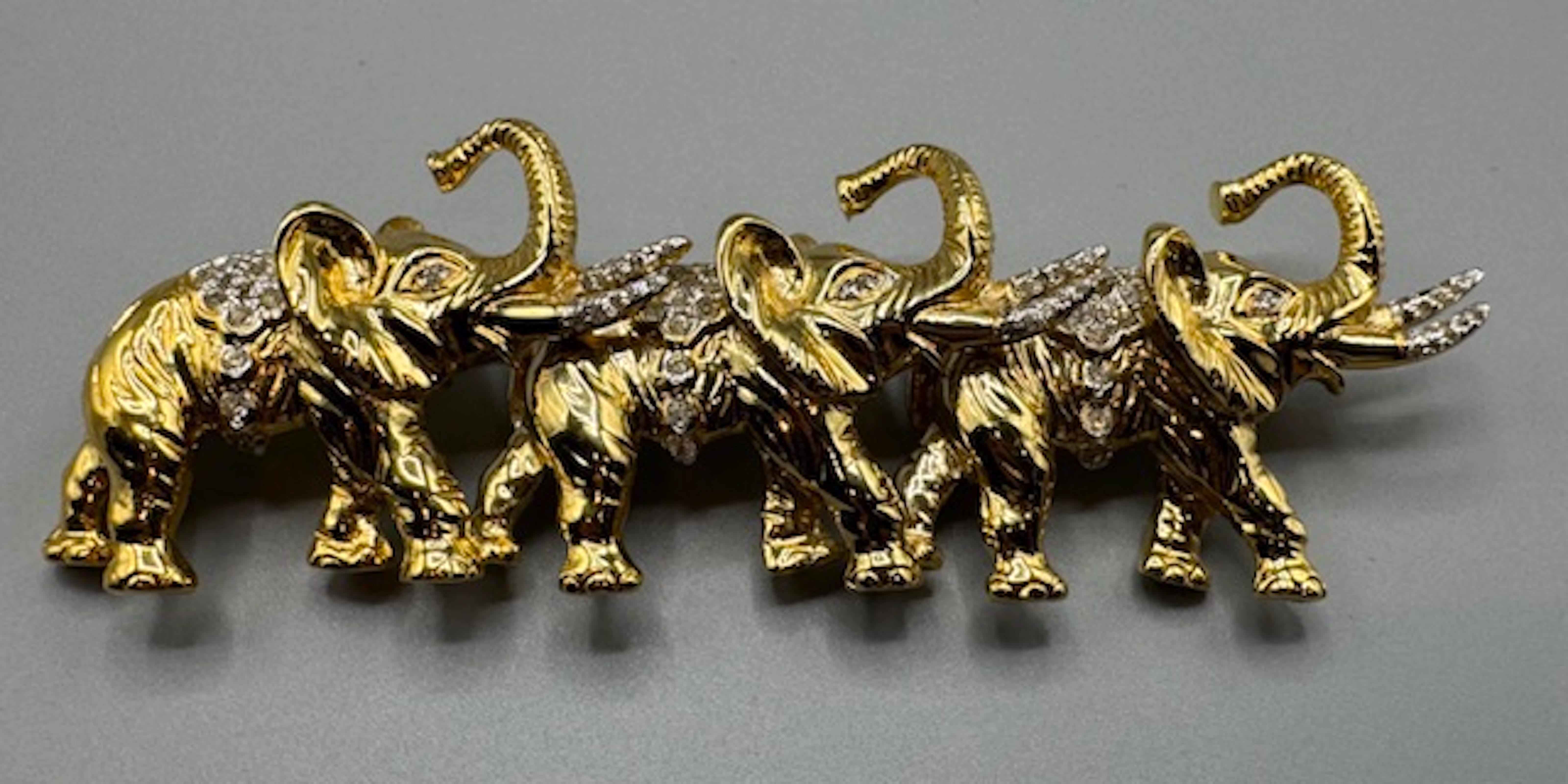 The Valentino Garavani Parade of Elephants brooch from the 1980s is a beautiful and collectible piece! The gold-tone metal, rhinestone accents, and Italian craftsmanship reflect the brand’s signature elegance. The brooch measures a large 3 inches in