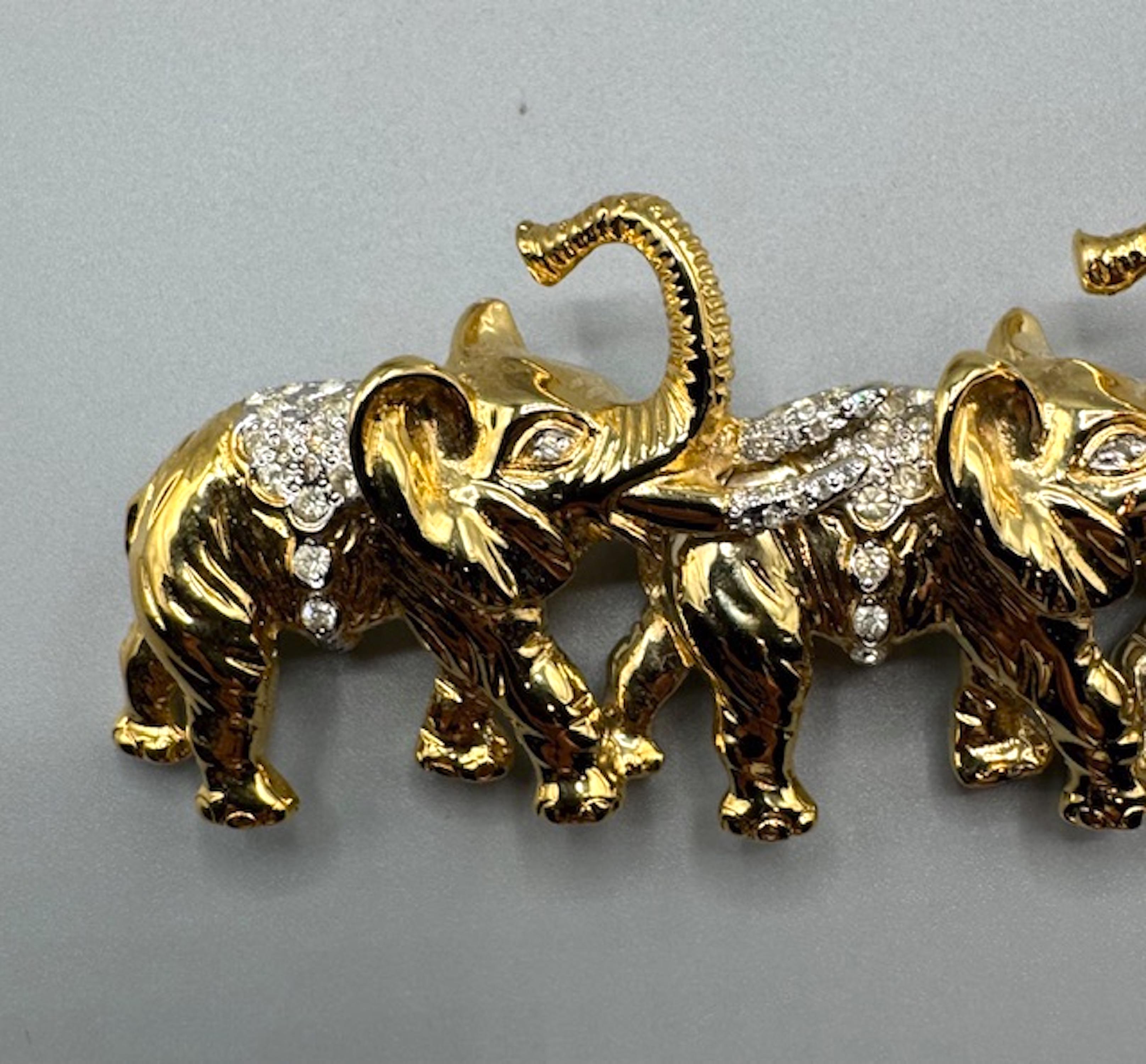 Valentino Garavani Gold & Rhinestone Parade of Elephants Brooch In Good Condition For Sale In New York, NY