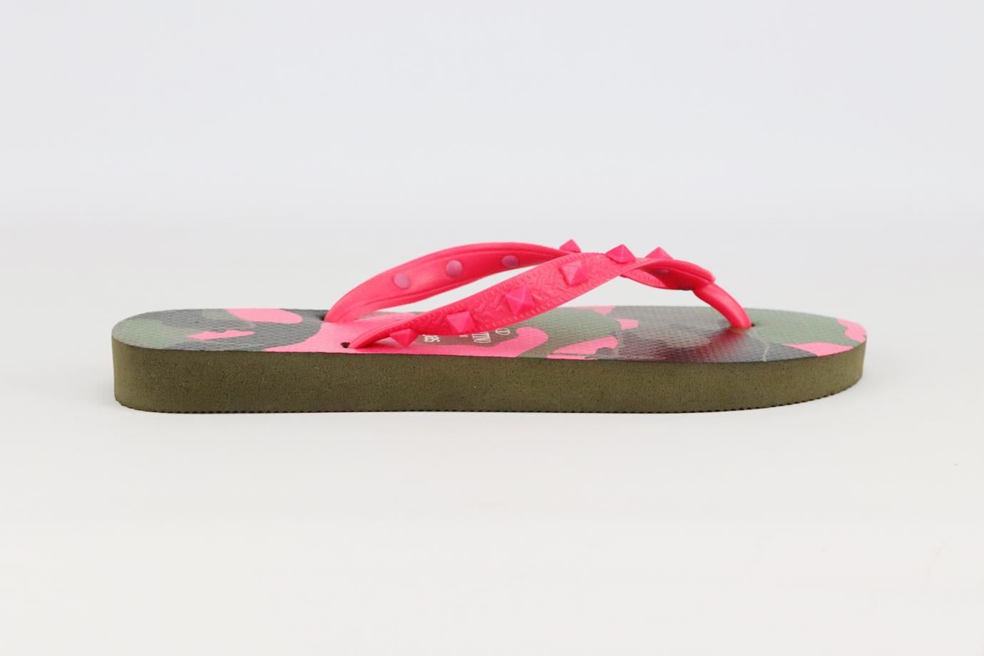 Valentino Garavani + Havaianas Rockstud camouflage print flip flops. Neon-pink, khaki, black and brown. Slips on. Does not come with box or dustbag. Size: EU 37/38 (UK 4/5, US 7/8). Insole: 10 in. Heel: 0.5 in
