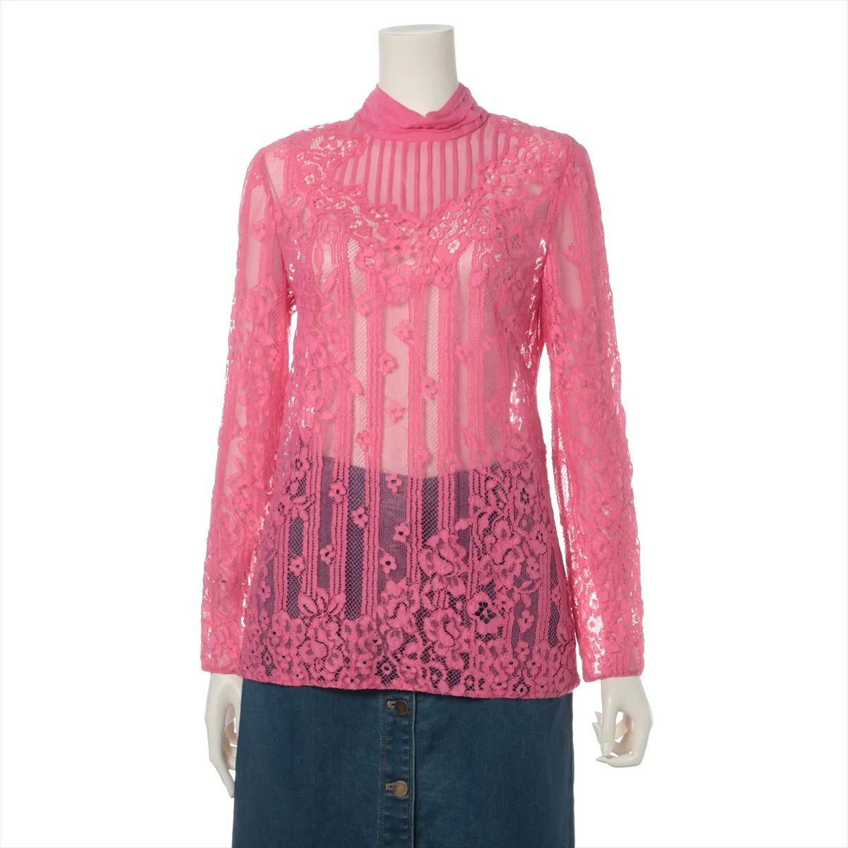 The Valentino Garavani Lace See-through Longsleeve Blouse in Pink is a delicate and feminine piece that exudes romantic elegance. Crafted from intricate lace, the blouse features a sheer construction that adds a touch of allure while showcasing the