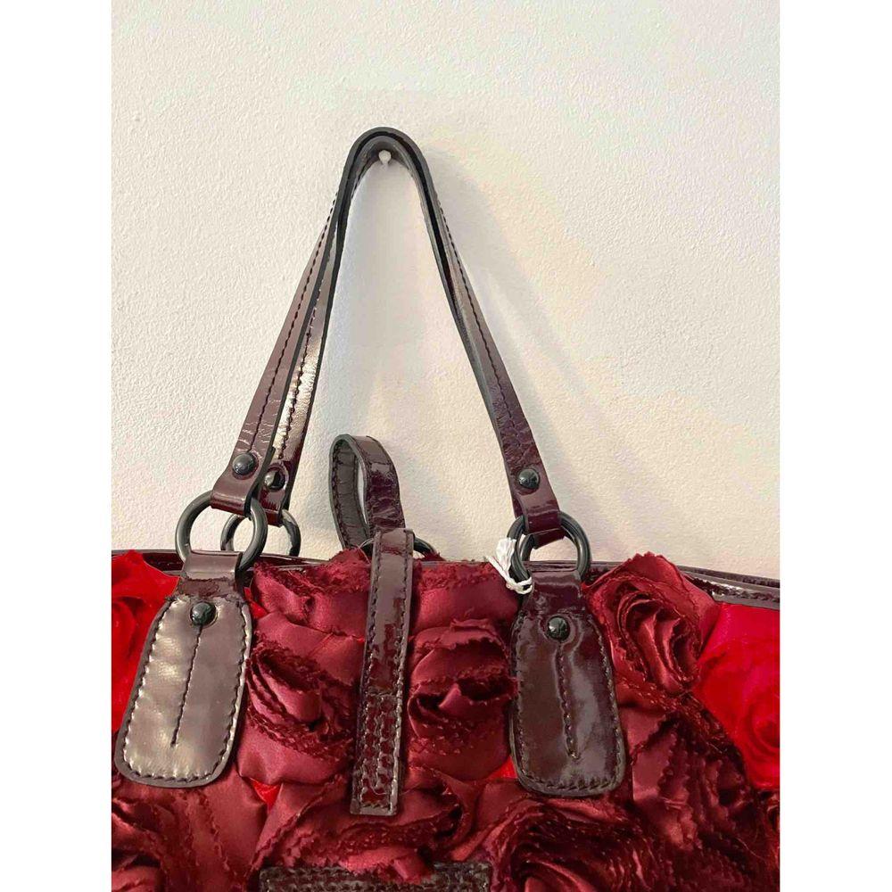 burgundy patent leather handbag