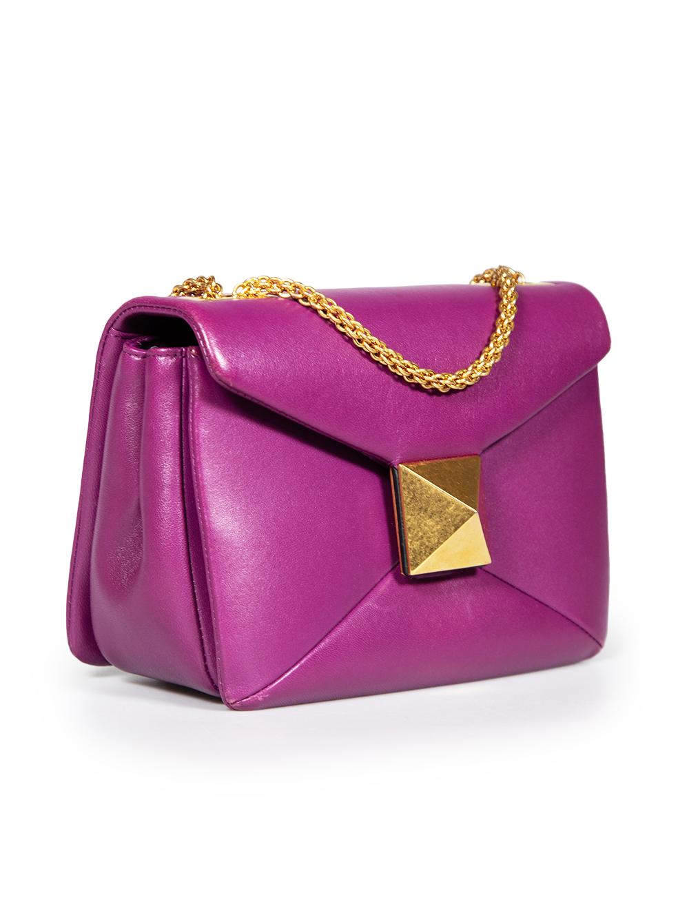CONDITION is Very good. Minimal wear to the bag is evident. Abrasion to the four base corners, either side of the front flap, the centre front and across the inside of the bag. Scratching and tarnishing to the rock stud clasp on this used Valentino
