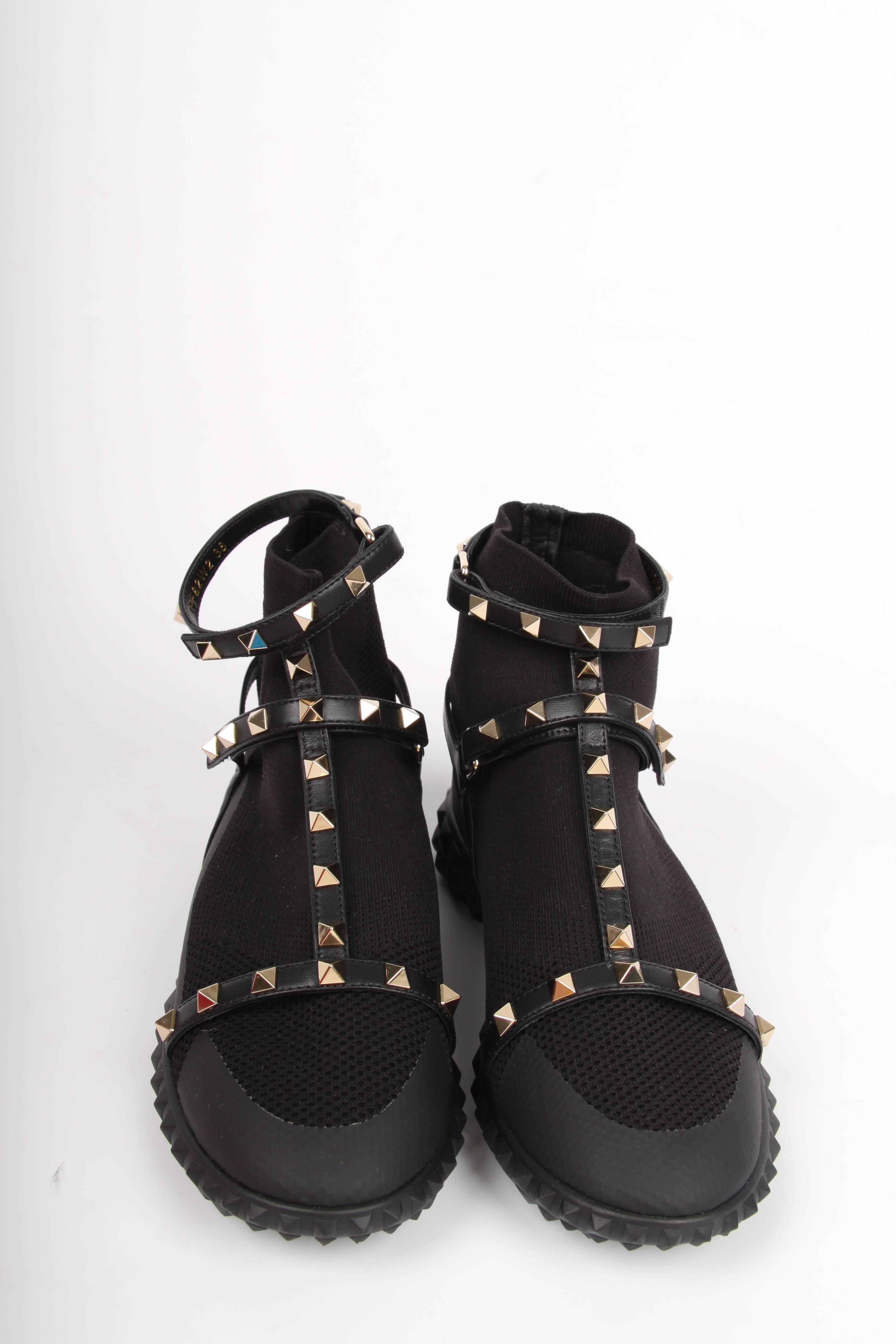 Sweeeet! Valentino Garavani Rockstud sneakers. Very comfortable!

Fully crafted from black stretching material with rubber and leather detailing, of course embellished with the signature studs in a light gold-tone. A round toe and padded footbed.