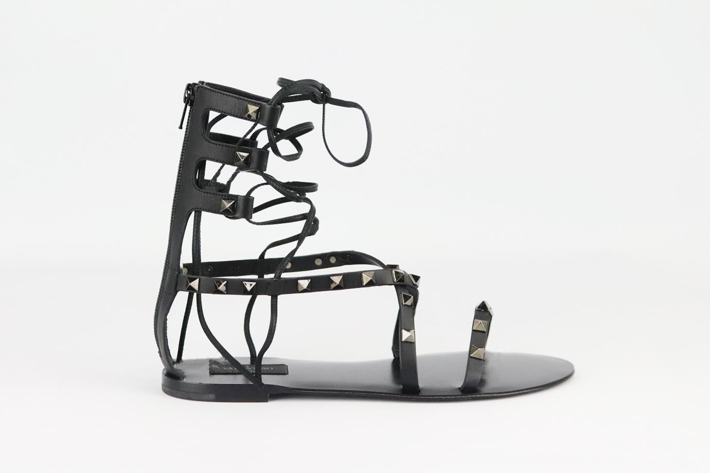 Valentino Garavani Rockstud lace up leather sandals. Black. Zip fastening at back. Does not come with box or dustbag. Size: EU 38 (UK 5, US 8). Insole: 9.5 in. Heel: 0.5 in
