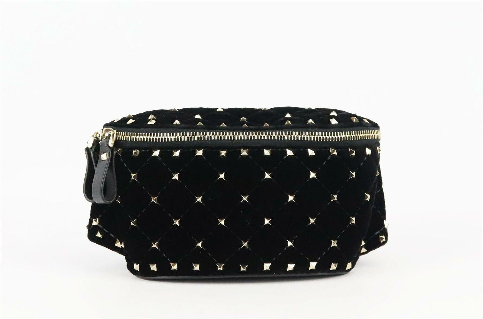 This Valentino Garavani belt bag has been made in Italy from black velvet that's punctuated with hand-applied 'Rockstud' spikes to accentuate the quilted finish, can easily fit you phone, keys inside and slip your cards in the back pocket.
Black