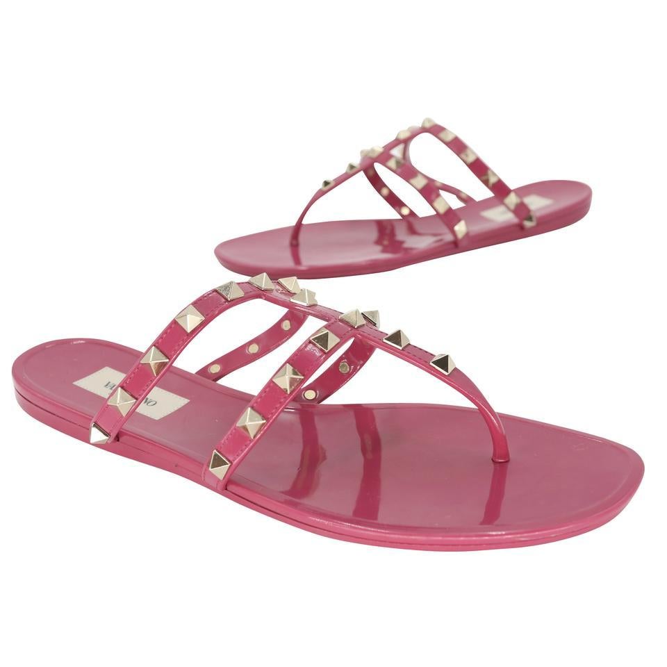 Here is another amazing collection by Valentino, their signature Gladiator rockstud elegant burgundy patent leather sandals with studded rockstud on PVC sandals very fashion-forward with elegant modern strap and glossy finish here is your chance to