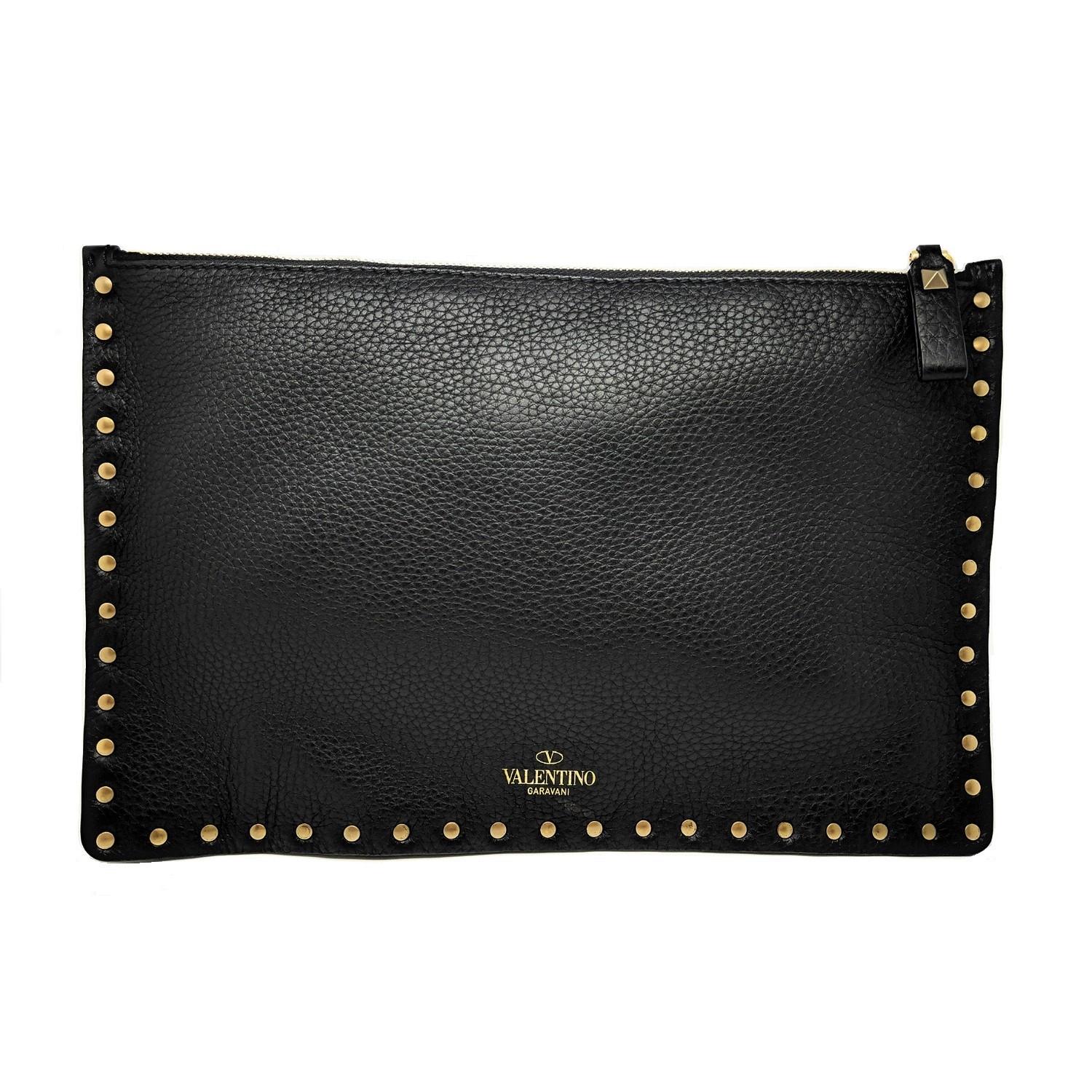 Valentino black Leather Rockstud Pouch with turquoise accents throughout, gold-tone exposed zip closure at top, and featuring a black suede interior.

Designer: Valentino
Material: Italian leather
Origin: Italy
Date/Authenticity Code: