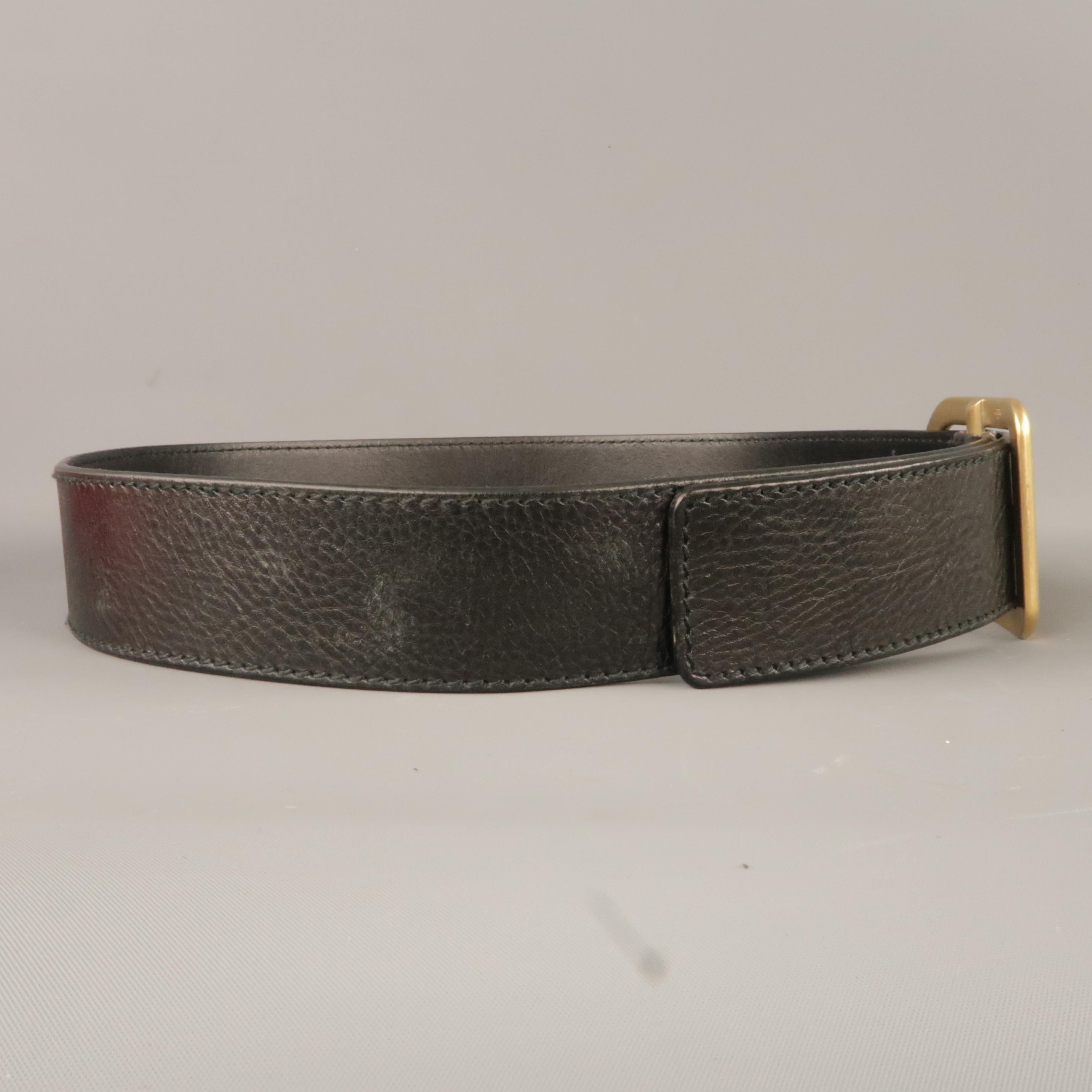 VALENTINO GARAVANI belt comes in a black leather featuring a gold tone buckle. Made in Italy.
 
New With Box.
Marked: 35/34
 
Length: 38 in.
Width: 1.8 in.
Fits: 30 - 34 in.
Buckle: 2 in.