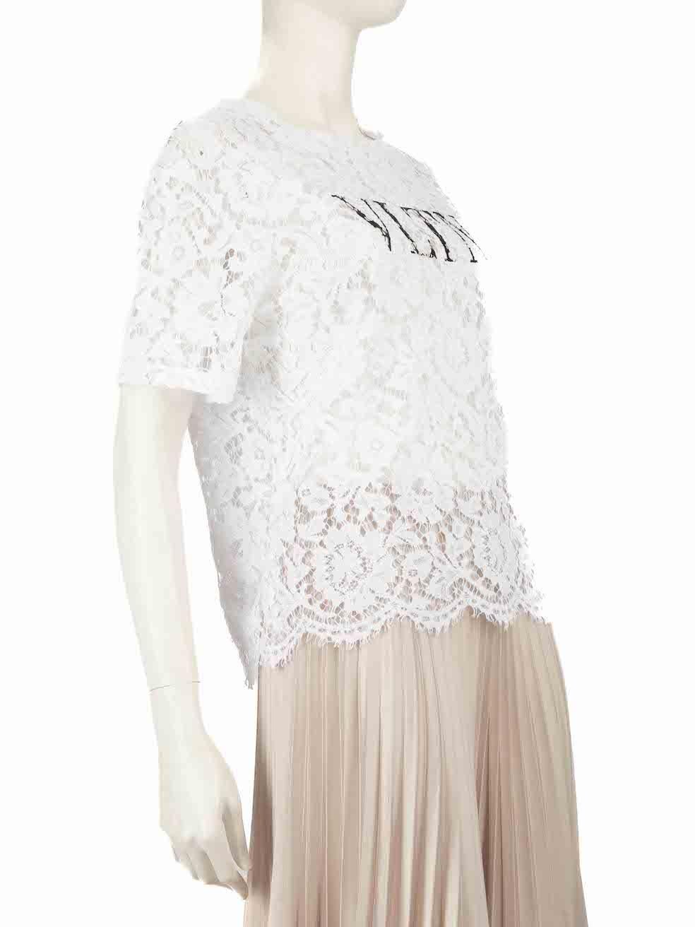 CONDITION is Never worn, with tags. No visible wear to the top is evident on this new Valentino Garavani designer resale item.
 
 
 
 Details
 
 
 White
 
 Lace
 
 Top
 
 See through
 
 Short sleeves
 
 Black VLTN print
 
 Round neck
 
 
 
 
 
 Made