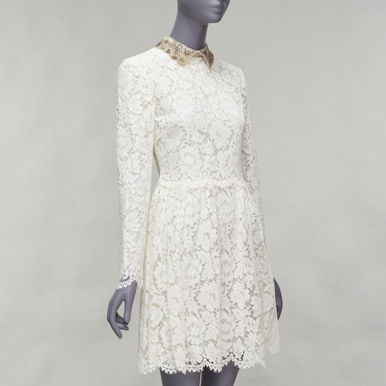 Grigio Valentino, abito da sposa in pizzo crema con collo ricamato e paillettes dorate in vendita