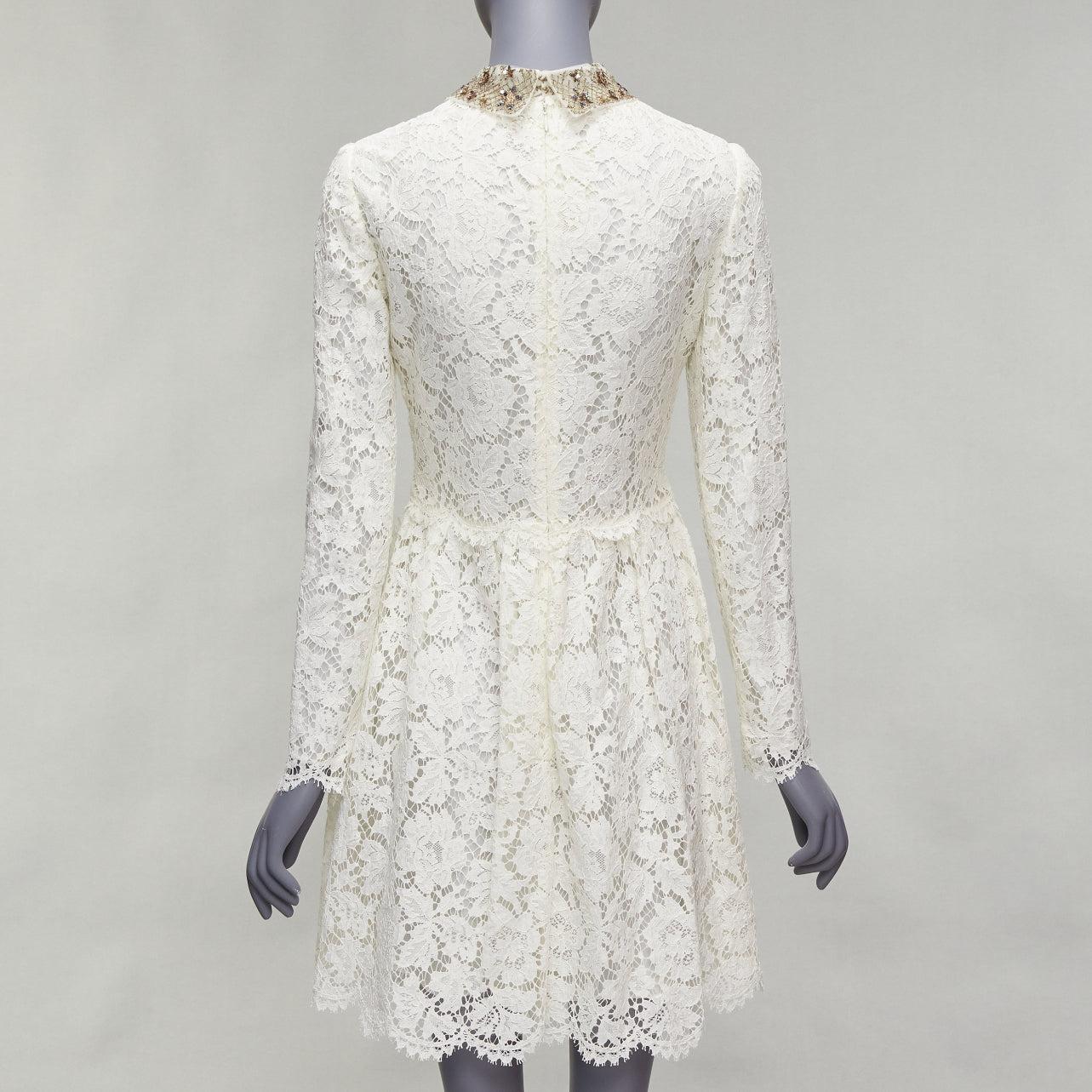 Donna Valentino, abito da sposa in pizzo crema con collo ricamato e paillettes dorate in vendita