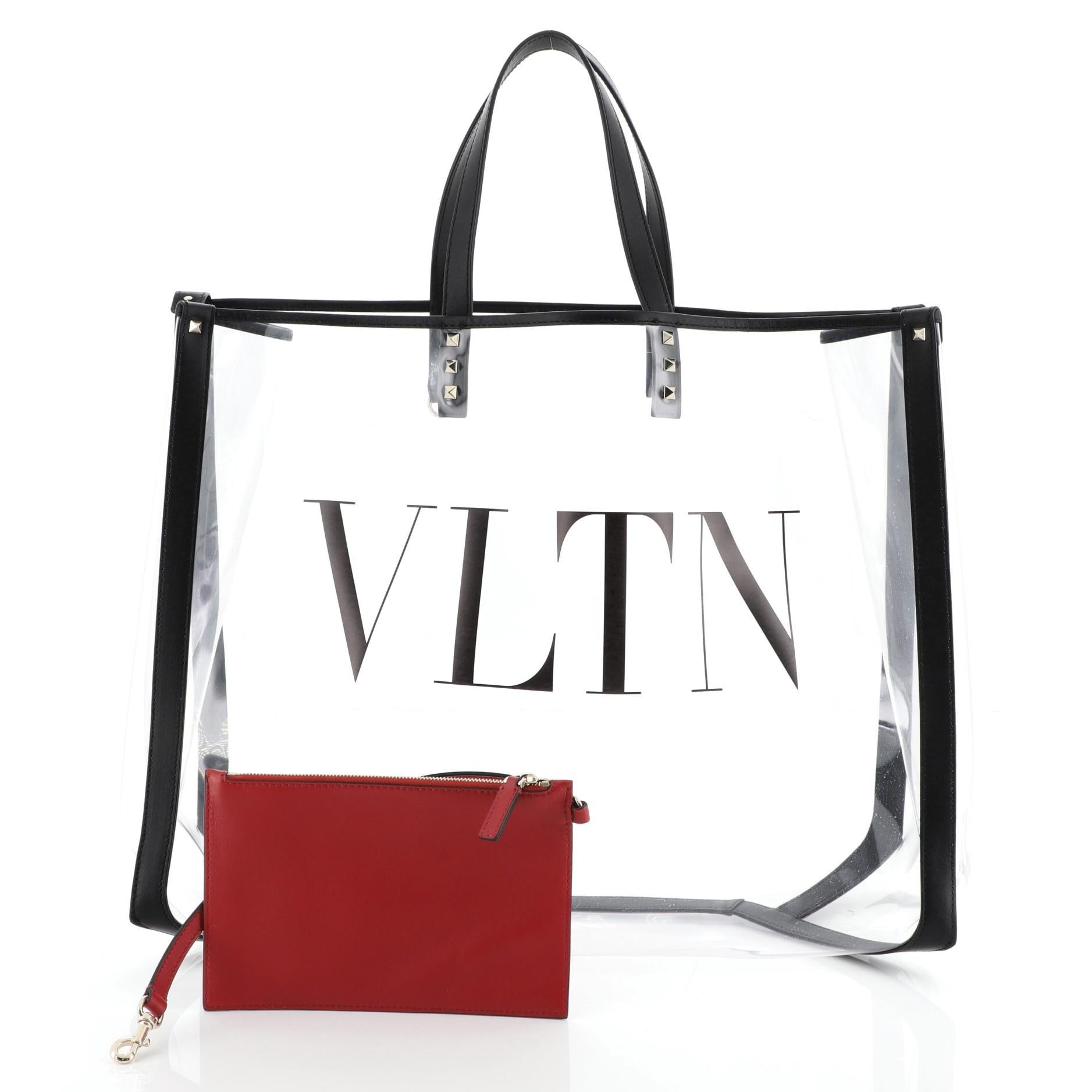 This Valentino Grande Plage VLTN Tote PVC Large, crafted from clear PVC, features dual flat handles, VLTN printed lettering at front and silver-tone hardware. It opens to a clear PVC interior. 

Estimated Retail Price: $1,175
Condition: Excellent.